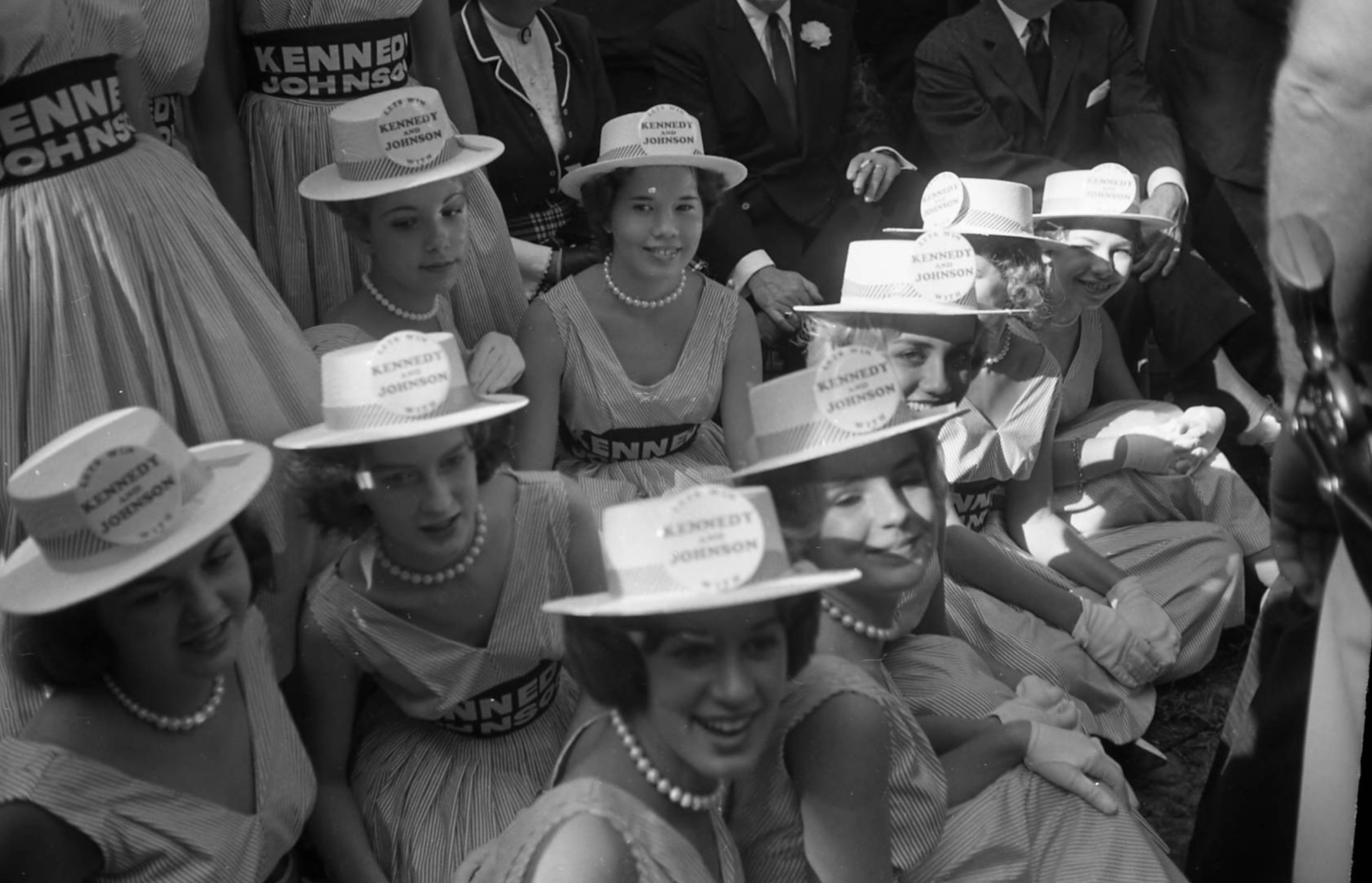 Women dressed in support of Kennedy's presidential campaign enjoy the day at the Little White House.