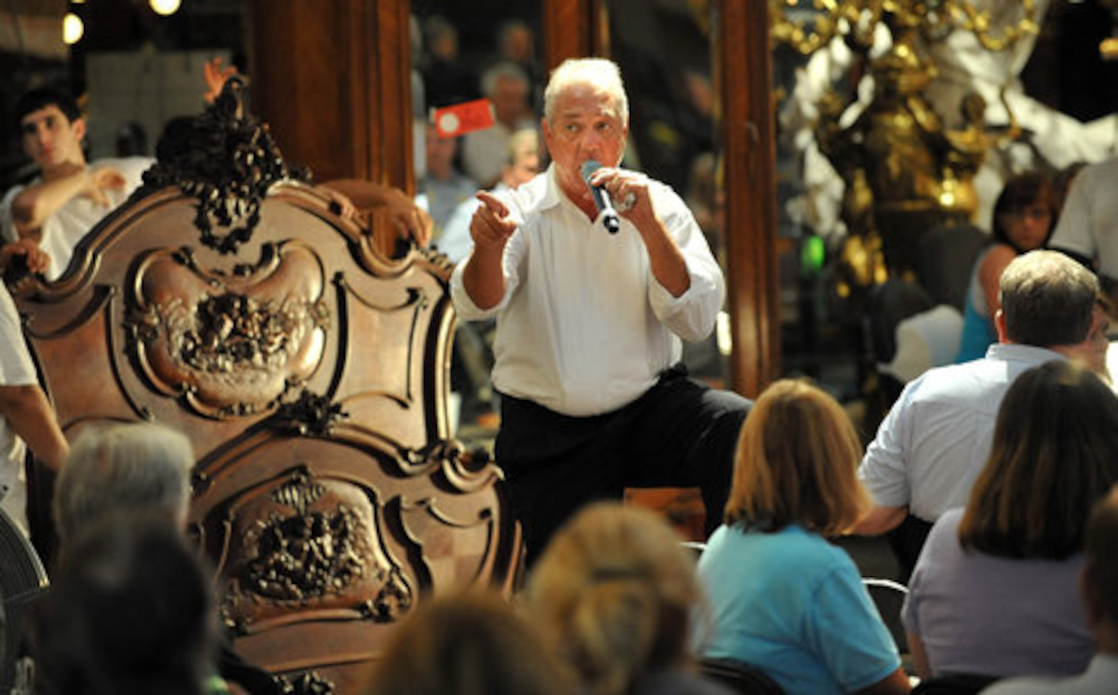 Auctioneer Guerry Wise calls to a bidder during the Saturday action at Red Baron Antique Auction. Red Baron holds its annual summer auction extravaganza where more than 2,500 rare and amazing treasures were available for purchase.