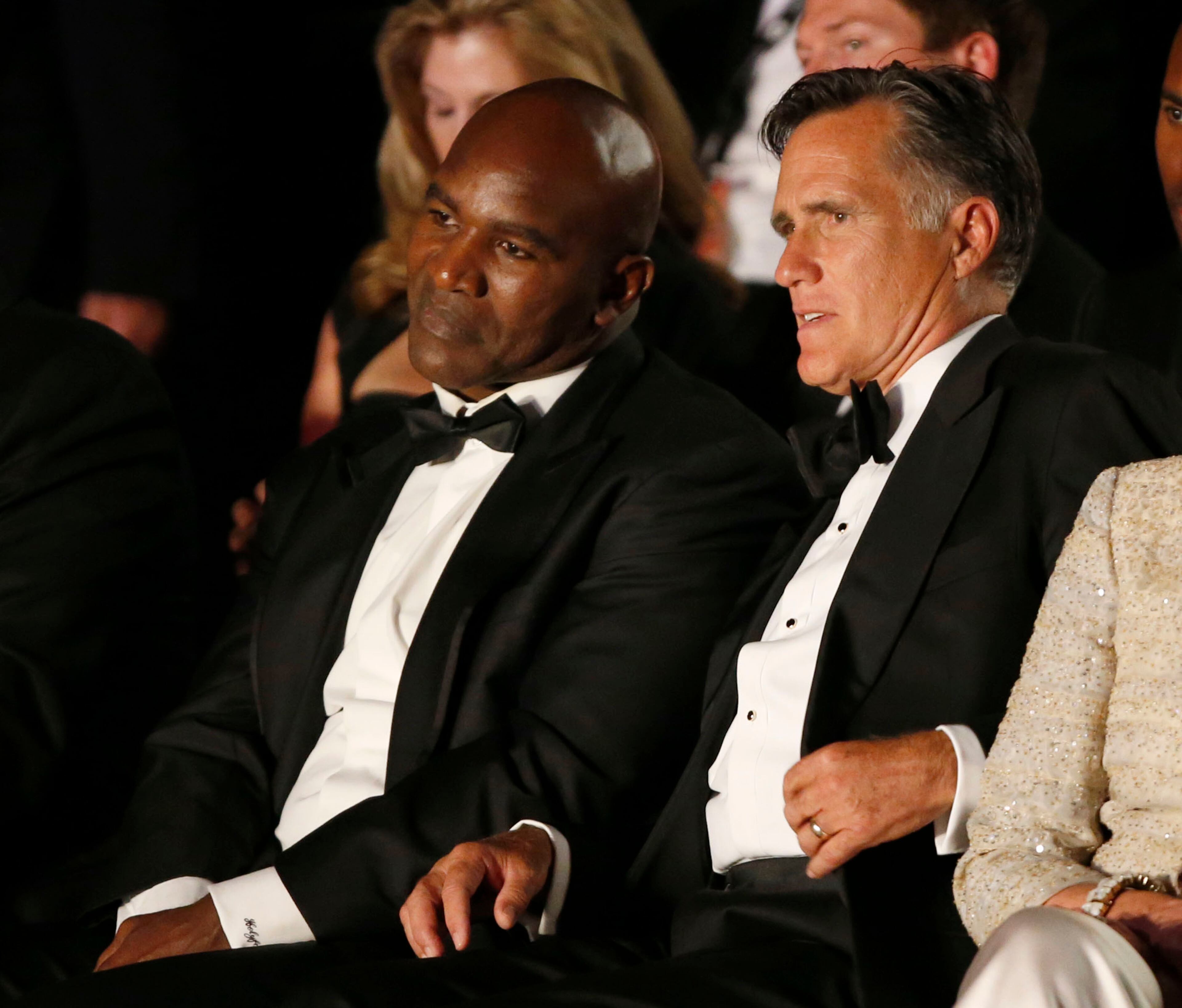 SALT LAKE CITY, UT - MAY 15: Evander Holyfield (L), Mitt Romney, (R) talk before Romney's and Holyfield's charity boxing event on May 15, 2015 in Salt Lake City, Utah. The event was held to raise money for "Charity Vision" a charity that aims to restore sight to the blind and visually impaired. (Photo by George Frey/Getty Images)