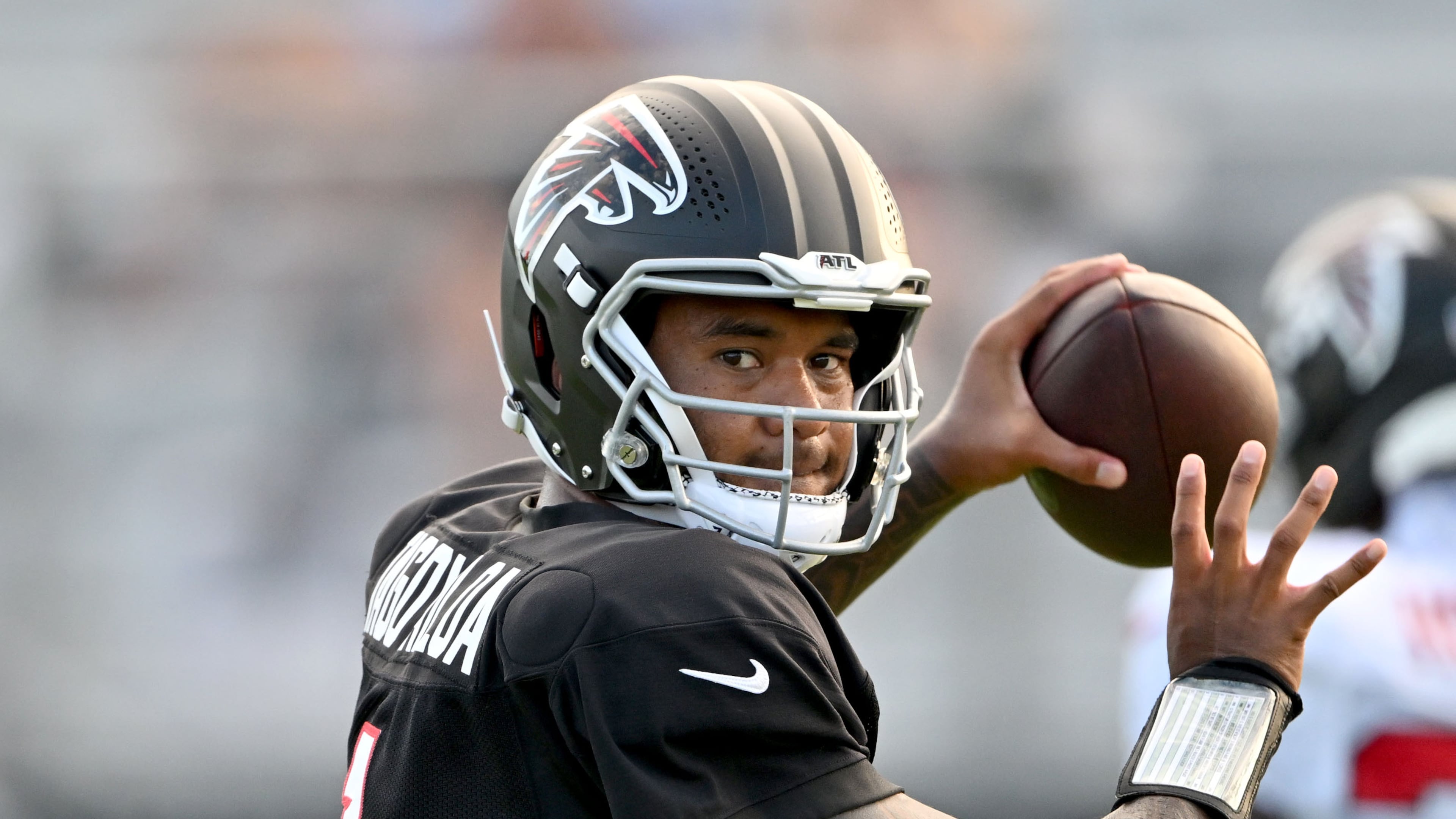 Falcons quarterback Tua Tagovailoa throws during a Saturday Night Lights practice at Lanier High School on Saturday, Aug. 8, 2026, in Sugar Hill. Tagovailoa will start in Friday’s preseason game against the Broncos. (Hyosub Shin/AJC)