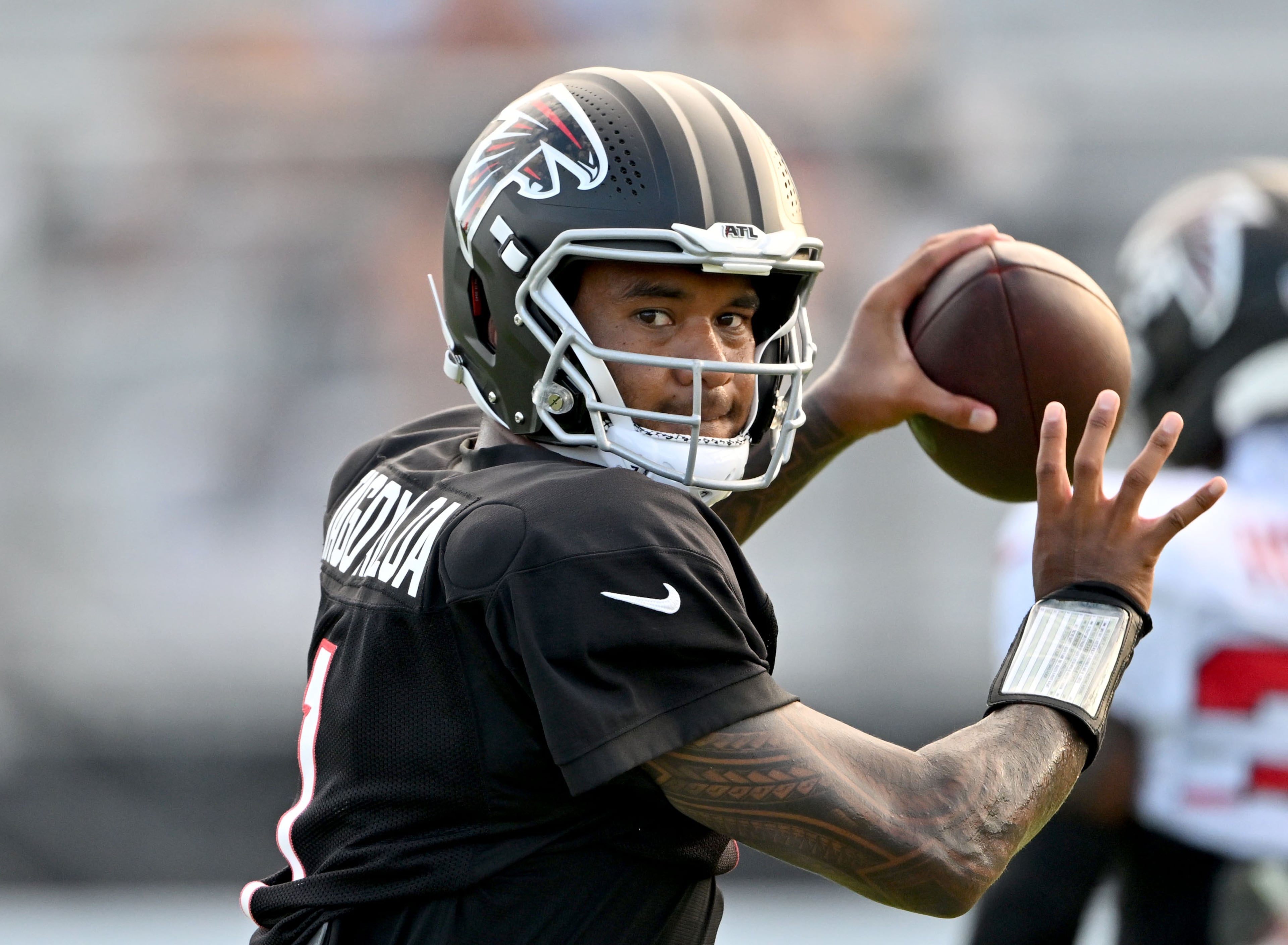 Falcons quarterback Tua Tagovailoa throws during the Falcons' "Saturday Night Lights" practice Saturday, Aug. 8, 2026, at Lanier High School in Sugar Hill. Tagovailoa went 6-for-8 passing with two touchdown passes. (Hyosub Shin/AJC)