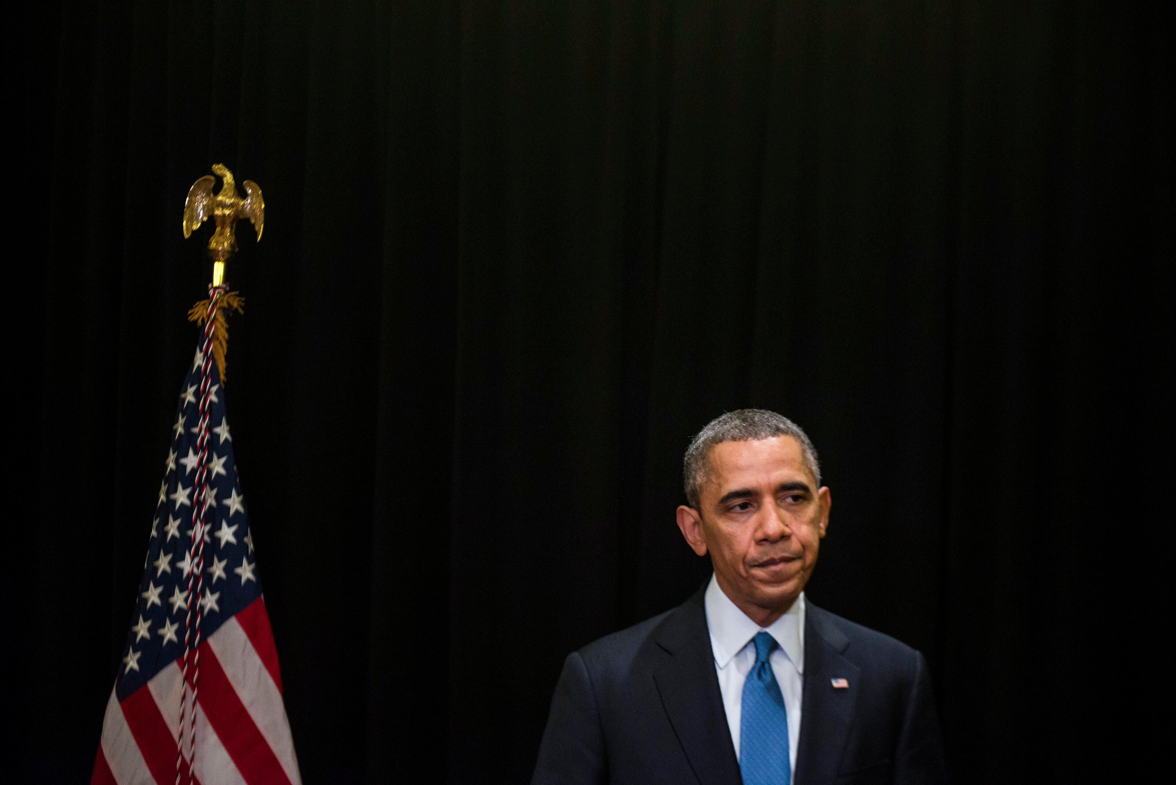 President Barack Obama gives a statement on a mass shooting in Fort Hood, Texas, after arriving in Chicago for a Democratic National Committee event, April 2, 2014. "We're heartbroken something like this might have happened again," Obama said, while emphasizing that details were still scarce from the Army base in Texas where a soldier killed 13 people in 2009. (Gabriella Demczuk/The New York Times)