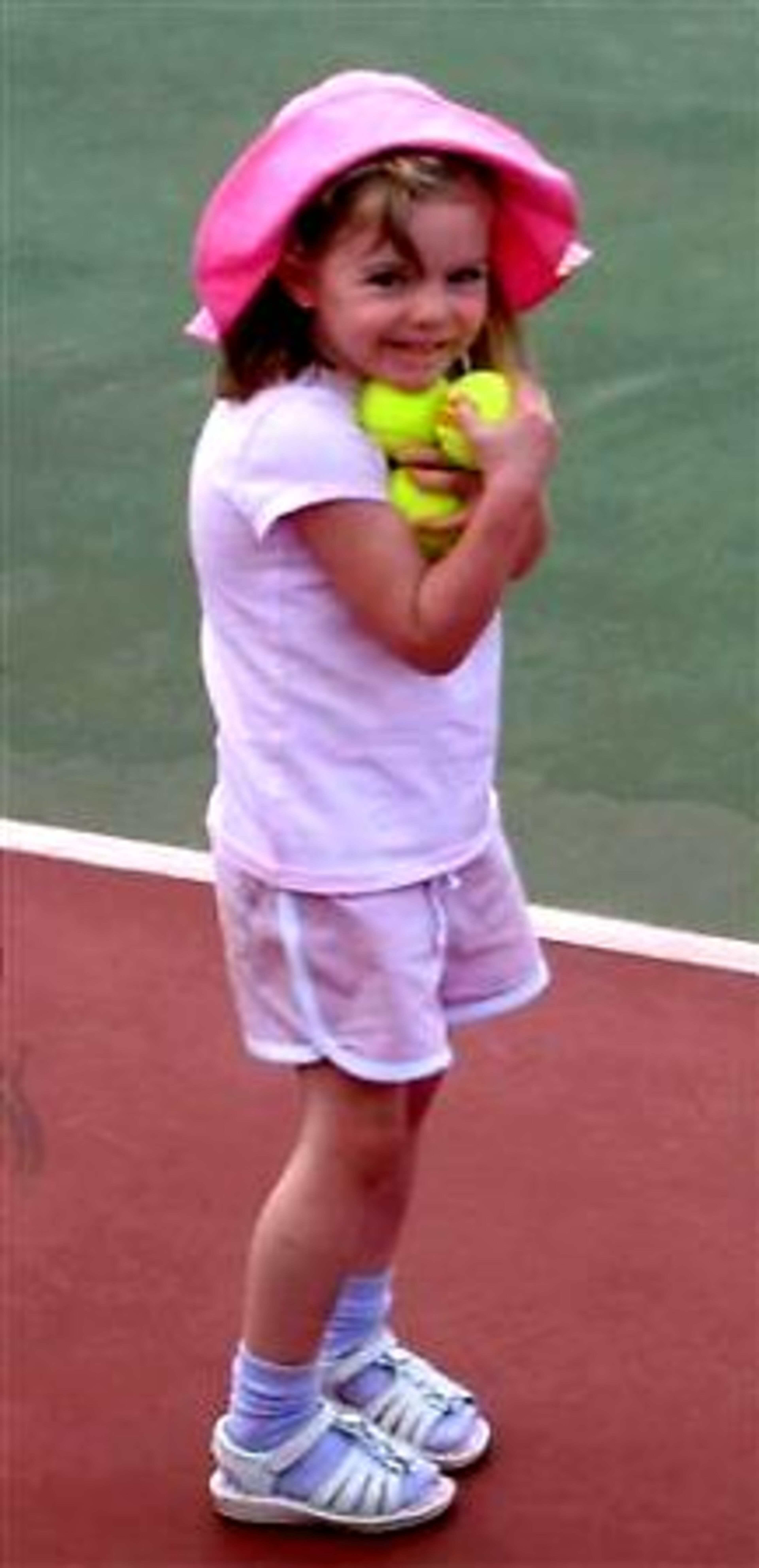 This is an undated photo released by the McCann family of missing Madeleine McCann taken during the family's holiday at Praia Da Luz, Algarve, Portugal. Kate McCann the mother of the missing British girl whose disappearance sparked a global search was formally named as a suspect by Portuguese police. Her husband Gerry has also been named a suspect, according to family members.