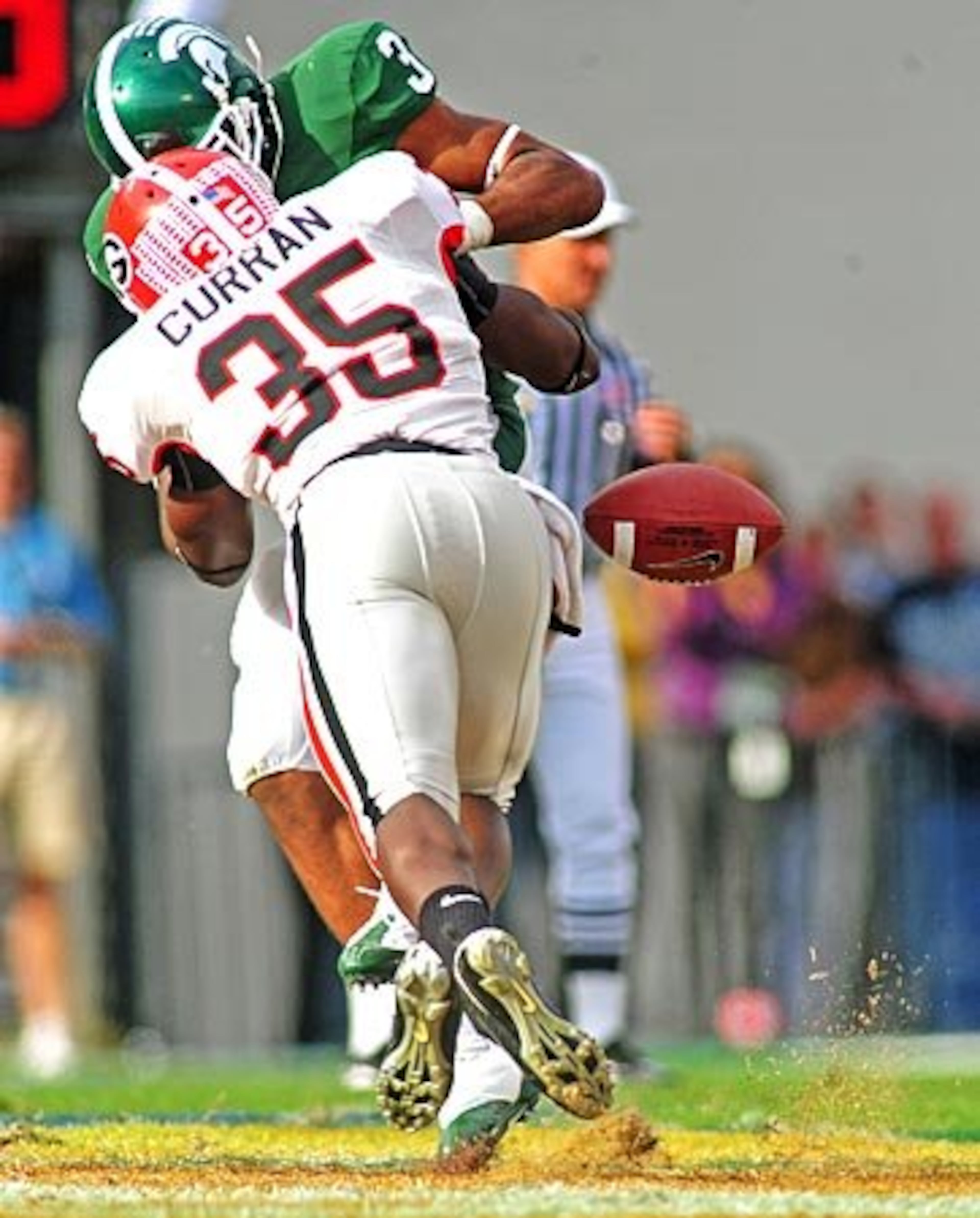 Georgia linebacker Rennie Curran (35) tackles Michigan State wide receiver B.J. Cunningham (3) and knocks the ball loose during the second half.