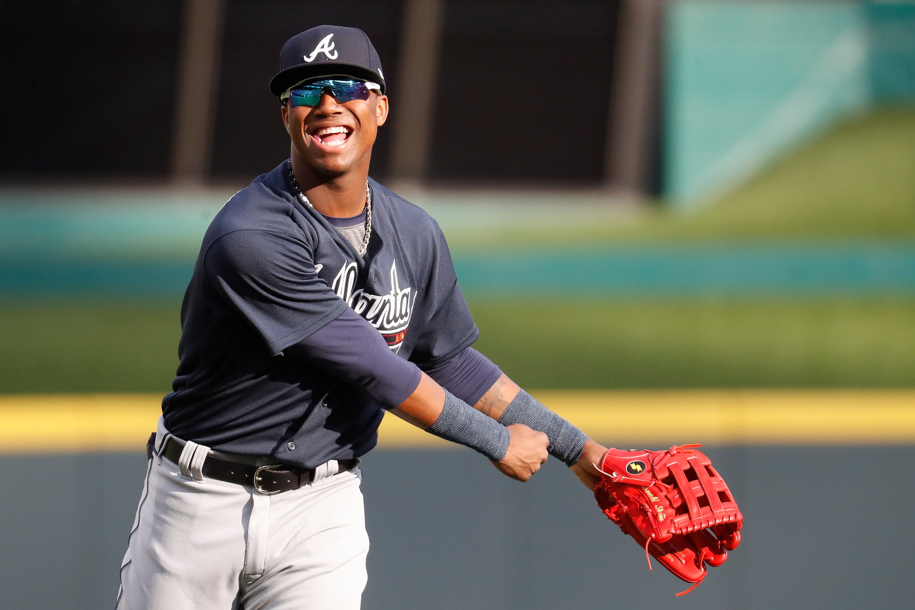 Atlanta Braves center fielder Ronald Acuna Jr. warms up for the team's baseball game against the Cincinnati Reds, Wednesday, April 25, 2018, in Cincinnati. (AP Photo/John Minchillo)
