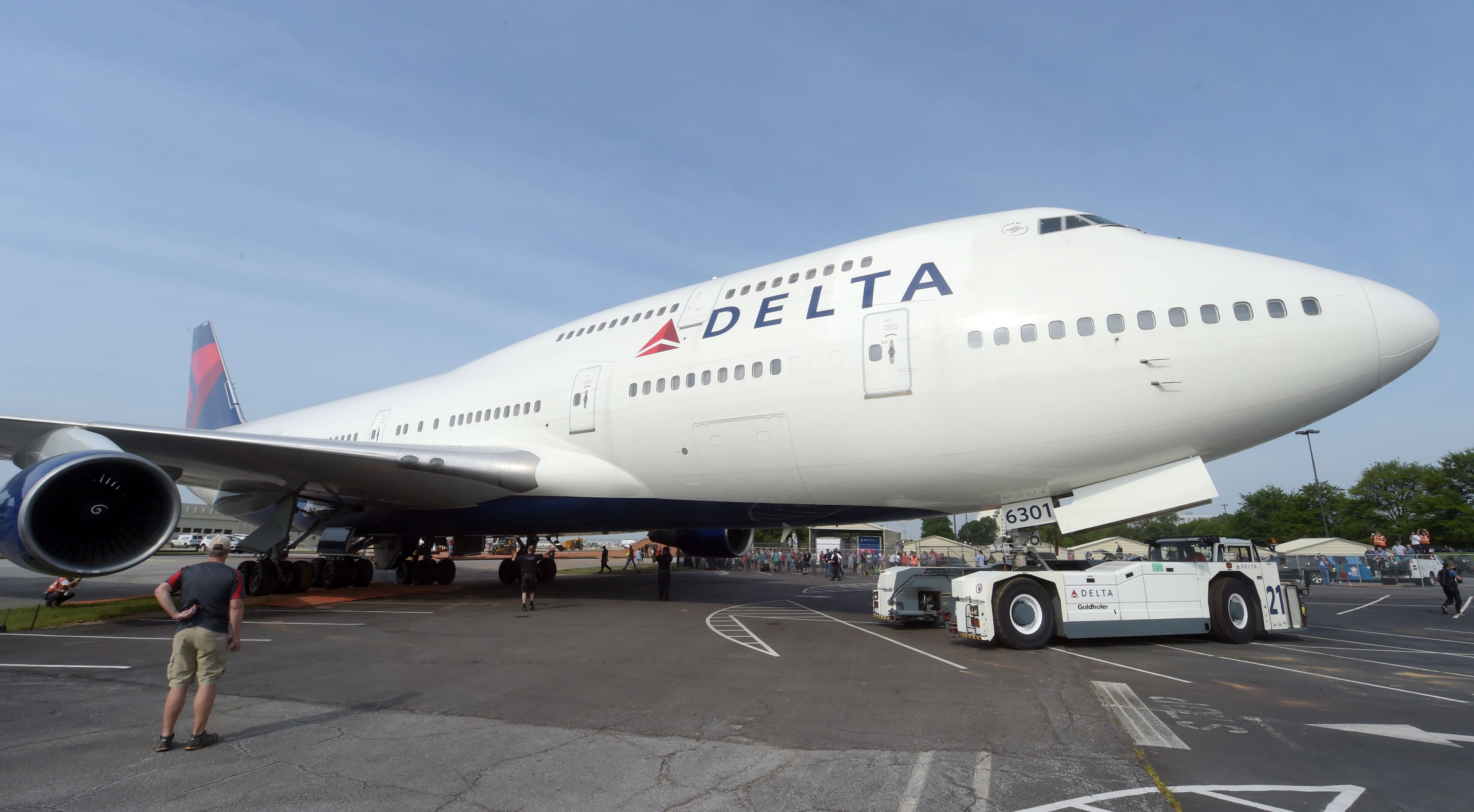 APRIL 30, 2016 ATLANTA Crews move a retired Boeing 747-400 to the Delta Flight museum Saturday, April 30, 2016. Delta Air Lines Ship 6301 made its final journey to Delta’s Atlanta world headquarters campus in preparation for the Delta Flight Museum's latest exhibit featuring the retired aircraft. On September 9, 2015, Delta retired Ship 6301, the first Boeing 747-400 aircraft manufactured for a commercial airline, after its final flight from Honolulu to Atlanta. KENT D. JOHNSON /kdjohnson@ajc.com #delta747experience