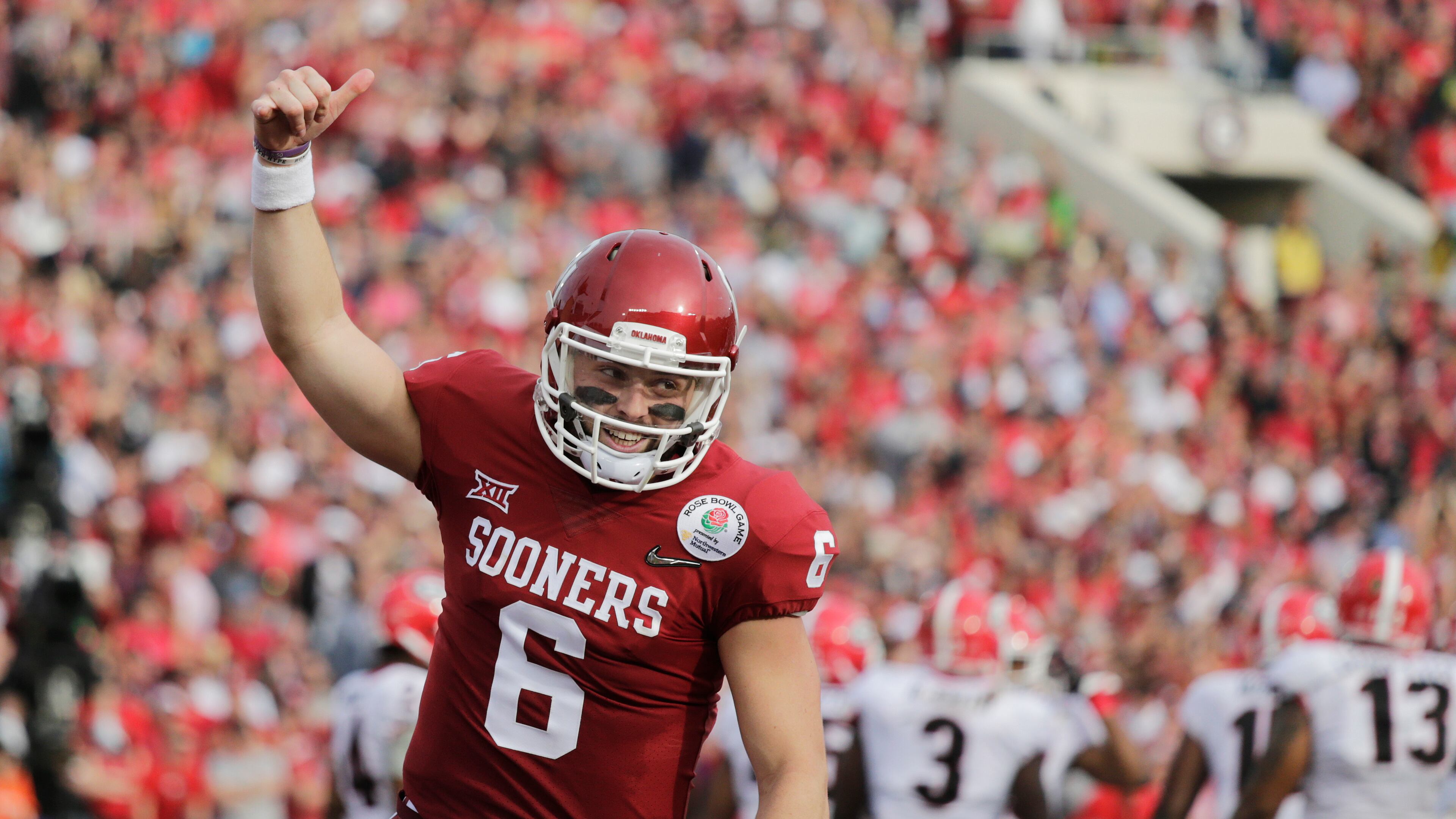 Oklahoma quarterback Baker Mayfield celebrates after running back Rodney Anderson scored a touchdown against Georgia during the first half of the Rose Bowl NCAA college football game Monday, Jan. 1, 2018, in Pasadena, Calif. (AP Photo/Jae C. Hong)