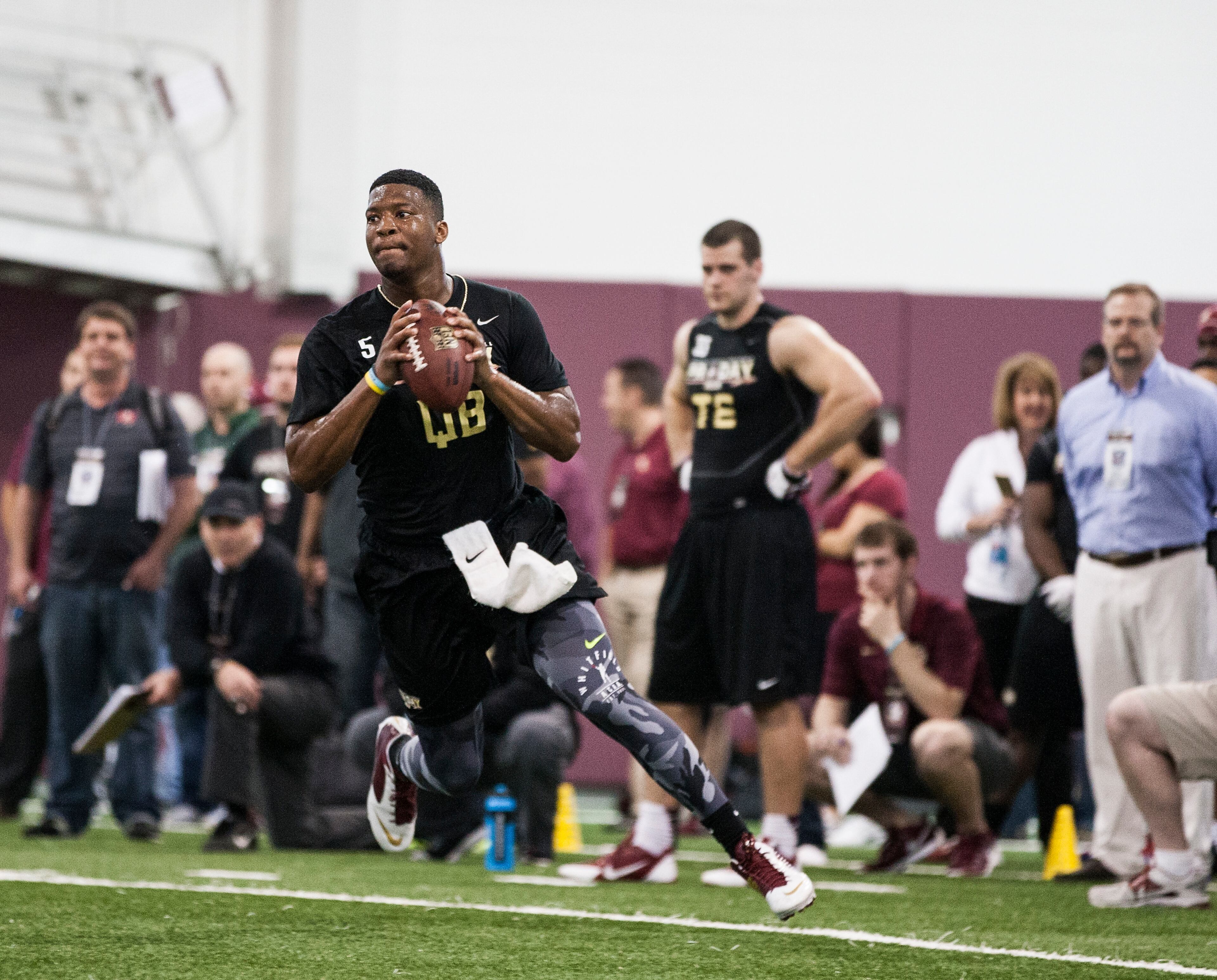 Jameis Winston rolls out to pass during Florida State football pro day in Tallahassee, Fla., Tuesday, March 31, 2015.