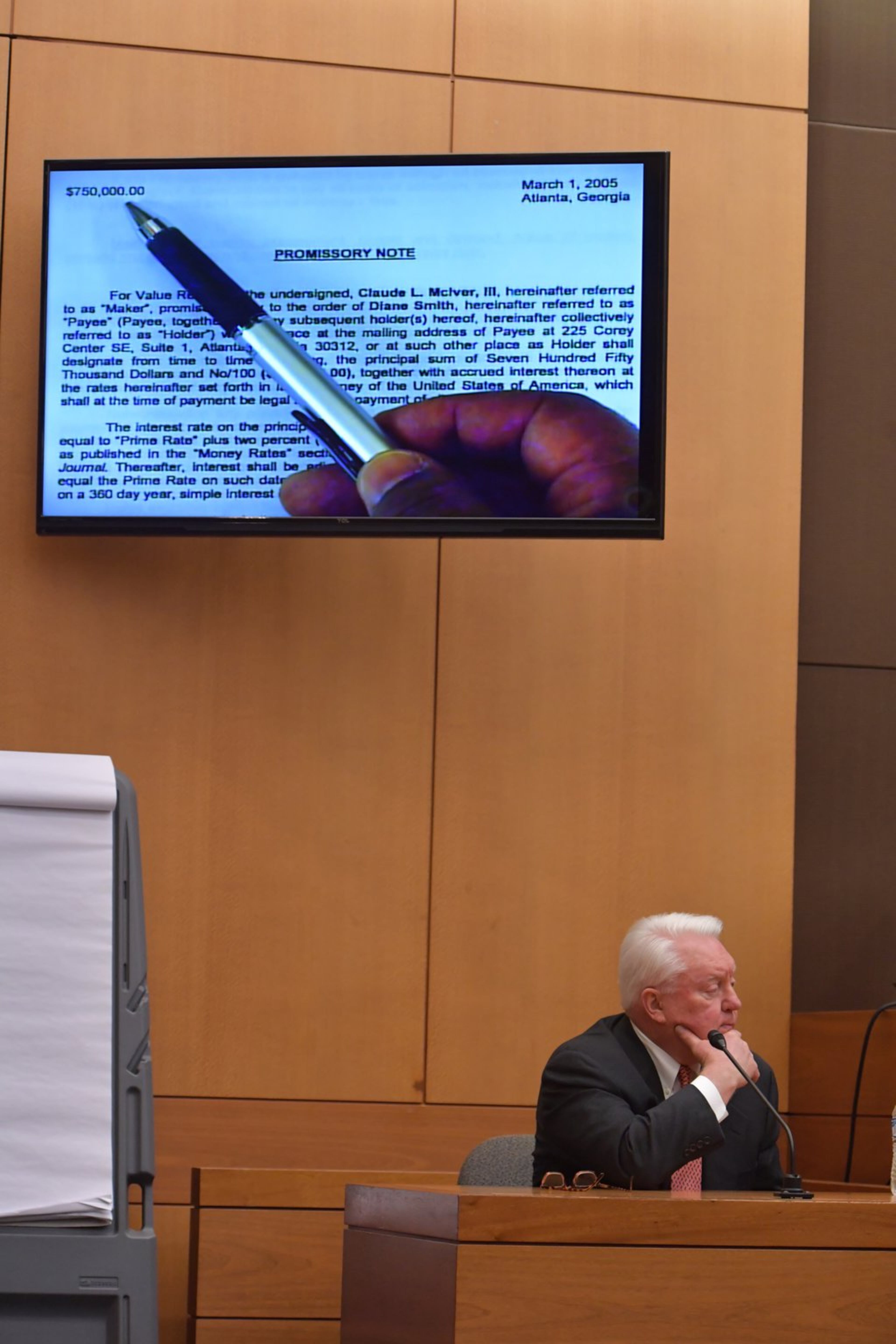 March 27, 2018 Atlanta - Kenneth Rickert, general counsel for U.S. Enterprises, testifies as a promissory note for a loan from Diane McIver to Claud “Tex” McIver for $755,000 plus interest, is displayed on a T.V. screen during Day 11 of the Tex McIver murder trial at Fulton County Courthouse on Tuesday, March 27, 2018. HYOSUB SHIN / HSHIN@AJC.COM