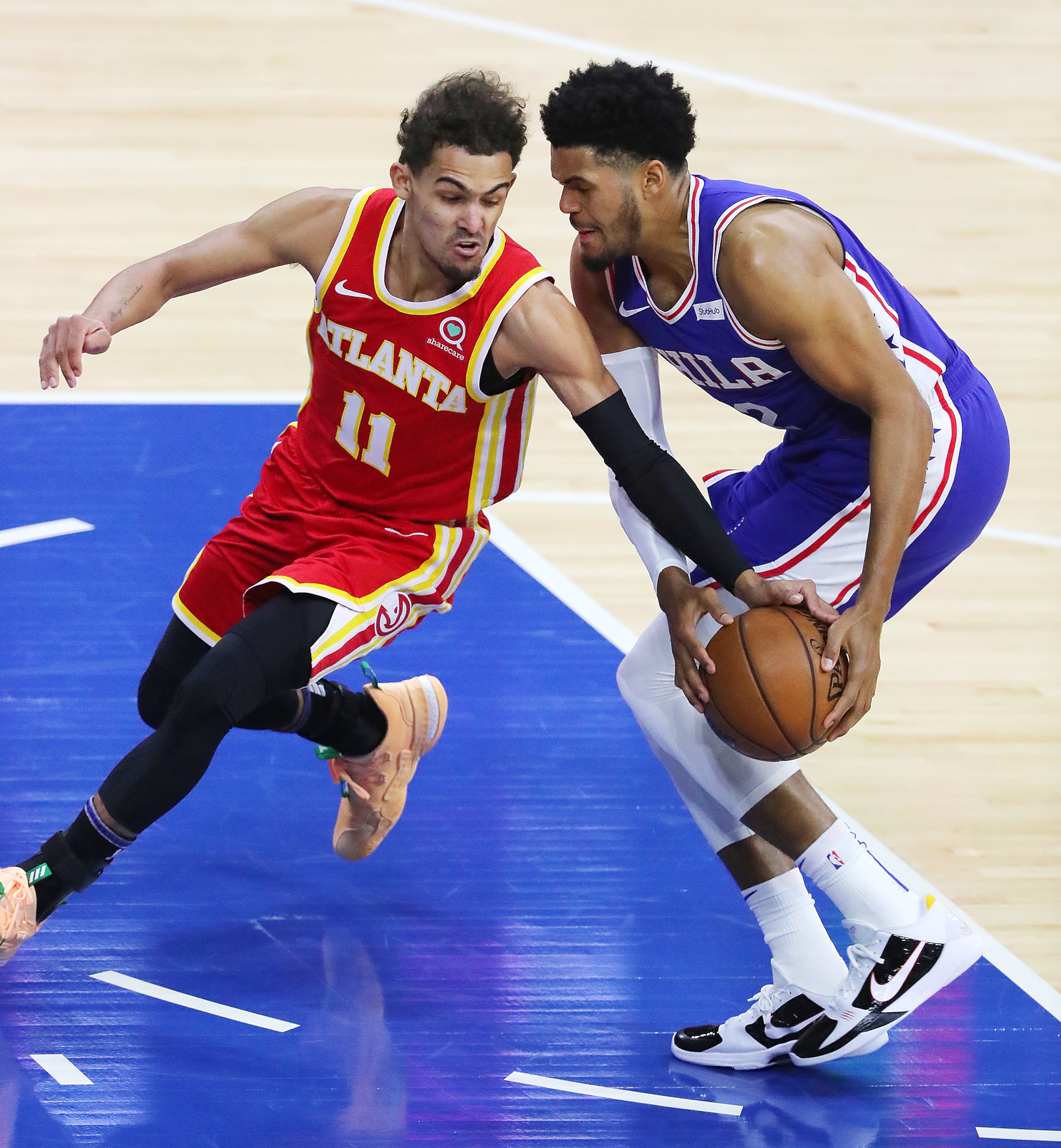 Atlanta Hawks guard Trae Young defends against Philadelphia 76ers forward Tobias Harris in game 2. “Curtis Compton / Curtis.Compton@ajc.com”