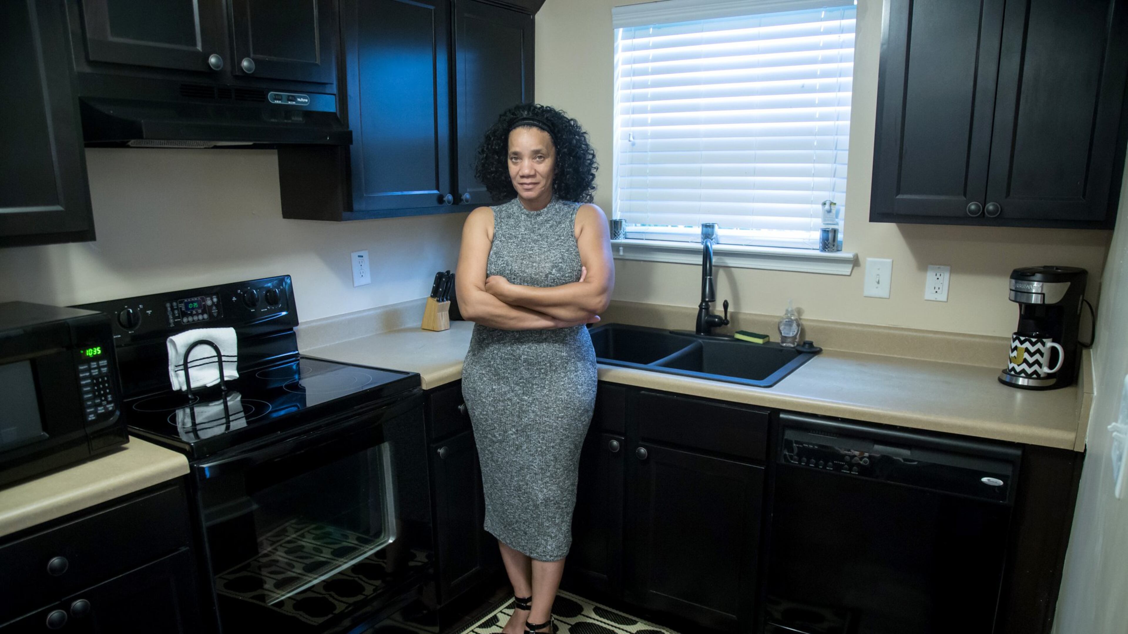 Jacqueline Atterberry in the kitchen of her Southwest Atlanta townhouse, which she had built in 2007. The housing bubble burst soon afterward, leaving her deeply ‘underwater.’ Atterberry hopes to be one of the 3,000 homeowners selected for the Underwater Georgia program, which would boost her equity. STEVE SCHAEFER / SPECIAL TO THE AJC