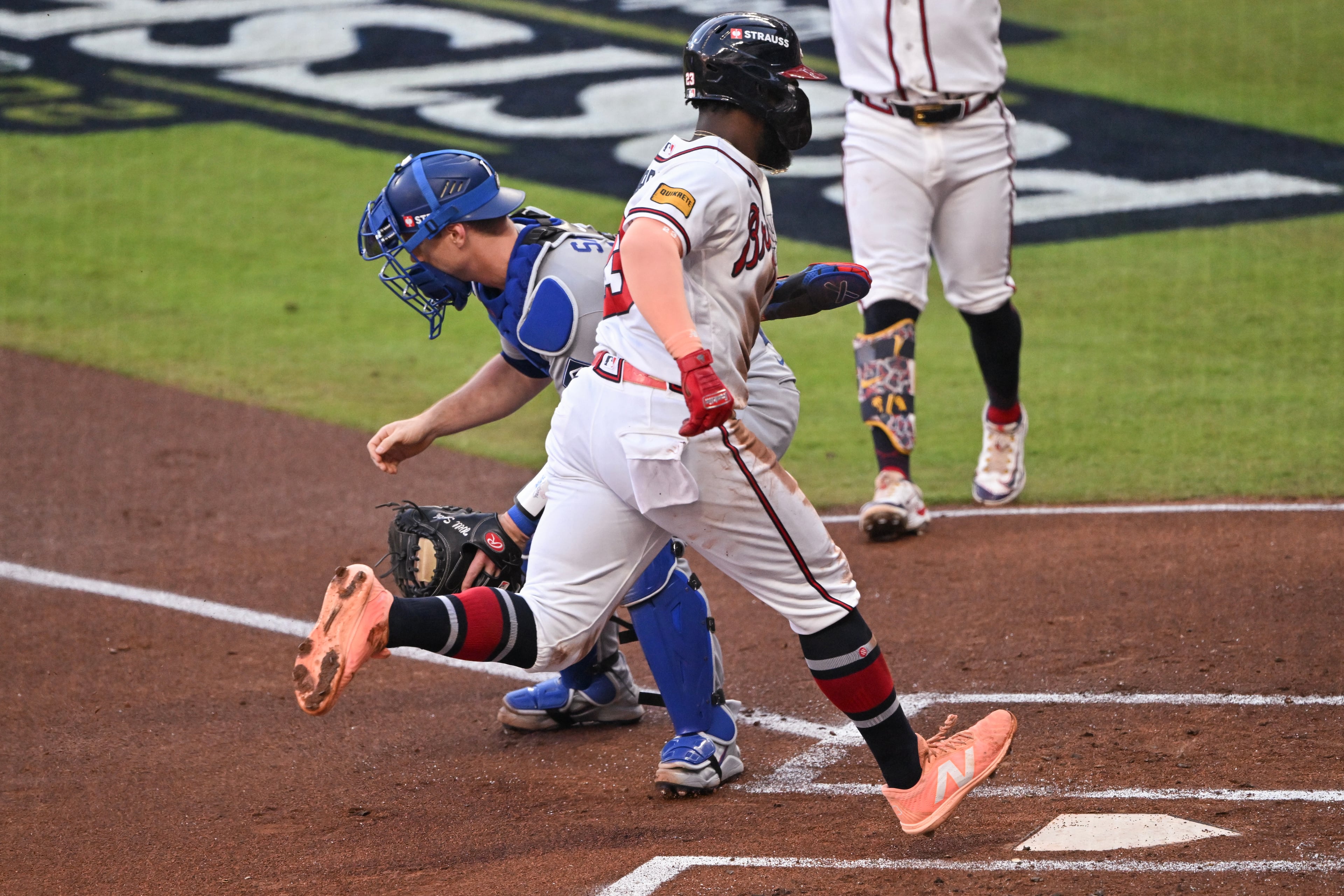 Atlanta Braves' Michael Harris II (23), scores on a wild pitch against Los Angeles Dodgers catcher Will Smith, left, during the first inning of Game 4 of the MLB National League Division Series between the Atlanta Braves and the Los Angeles Dodgers, Wednesday, Oct. 7, 2026, in Atlanta. (Hyosub Shin/AJC)