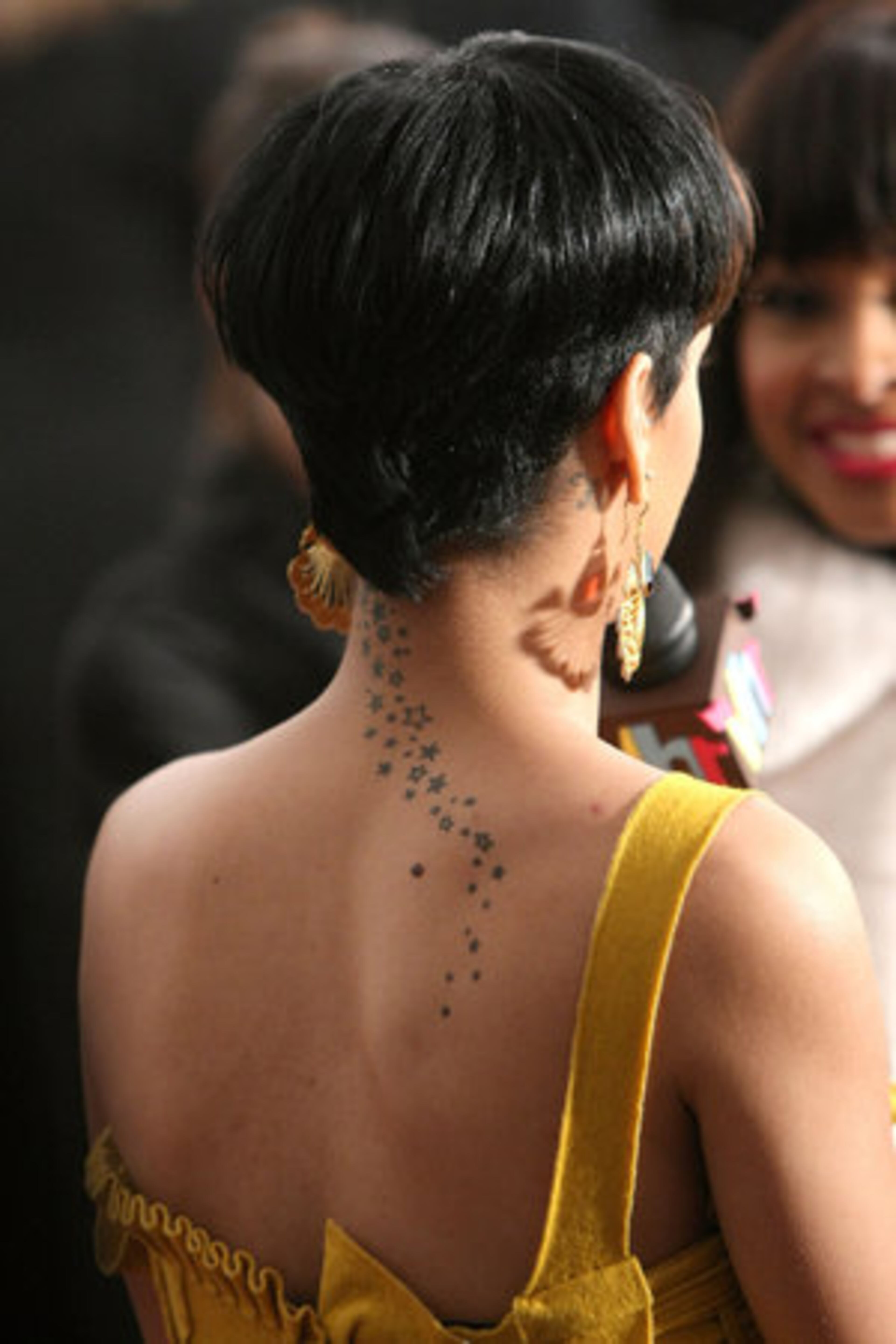 Rihanna has some strategically placed tattoos, including on her neck and back. She showed them off at the Feeding America's Inauguration Charity Ball on Jan. 20 in Washington, DC.