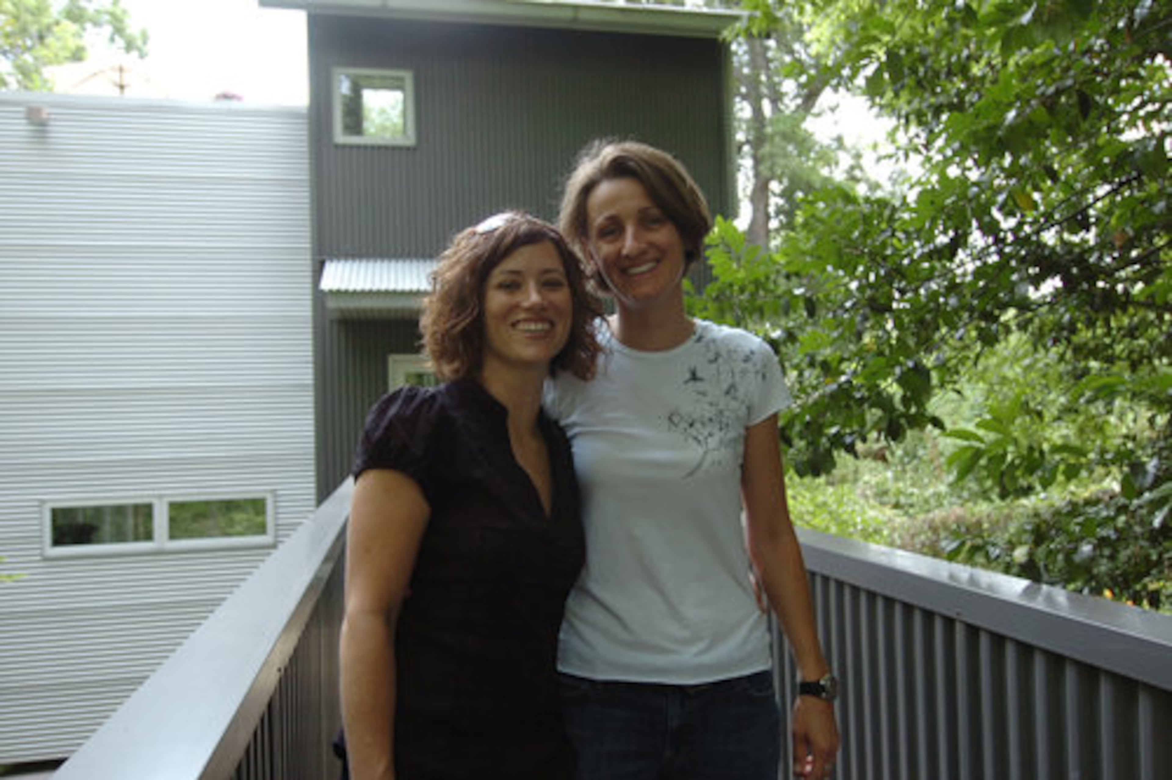 The unusual design of the treehouse, along with its easy-care exterior and completely wired sound system, made it attractive to Kristi Bowers (left) and Rachel Hovington. "We talked to the architect before we bought it and learned how great it is," Bowers said.