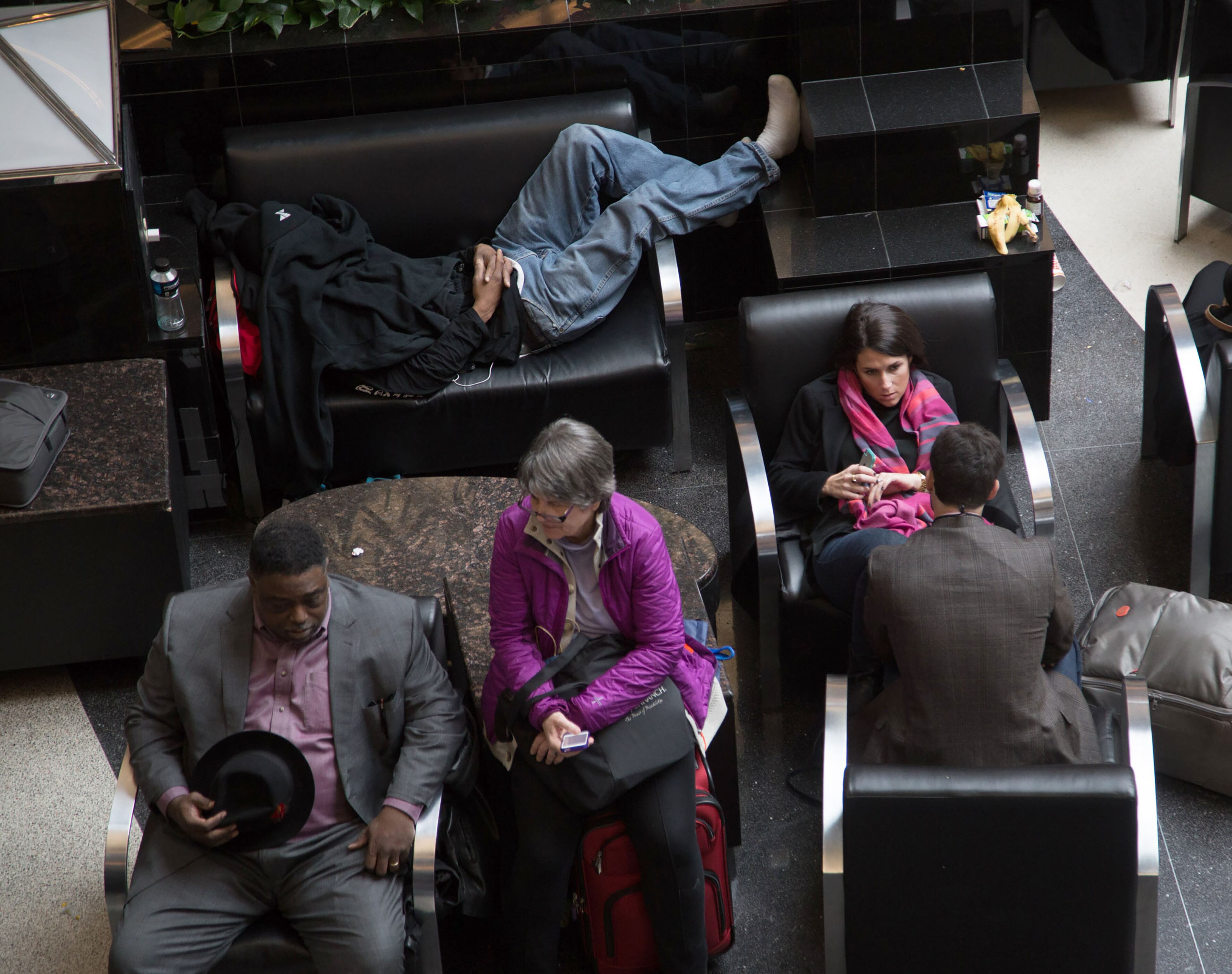 Passengers wait for the lights to come back on at Hartsfield-Jackson International Airport Sunday, December 17, 2017. The Airport is reporting a loss of electricity. The FlightAware site reports the airport is currently holding all inbound flights due to an equipment outage. STEVE SCHAEFER / SPECIAL TO THE AJC
