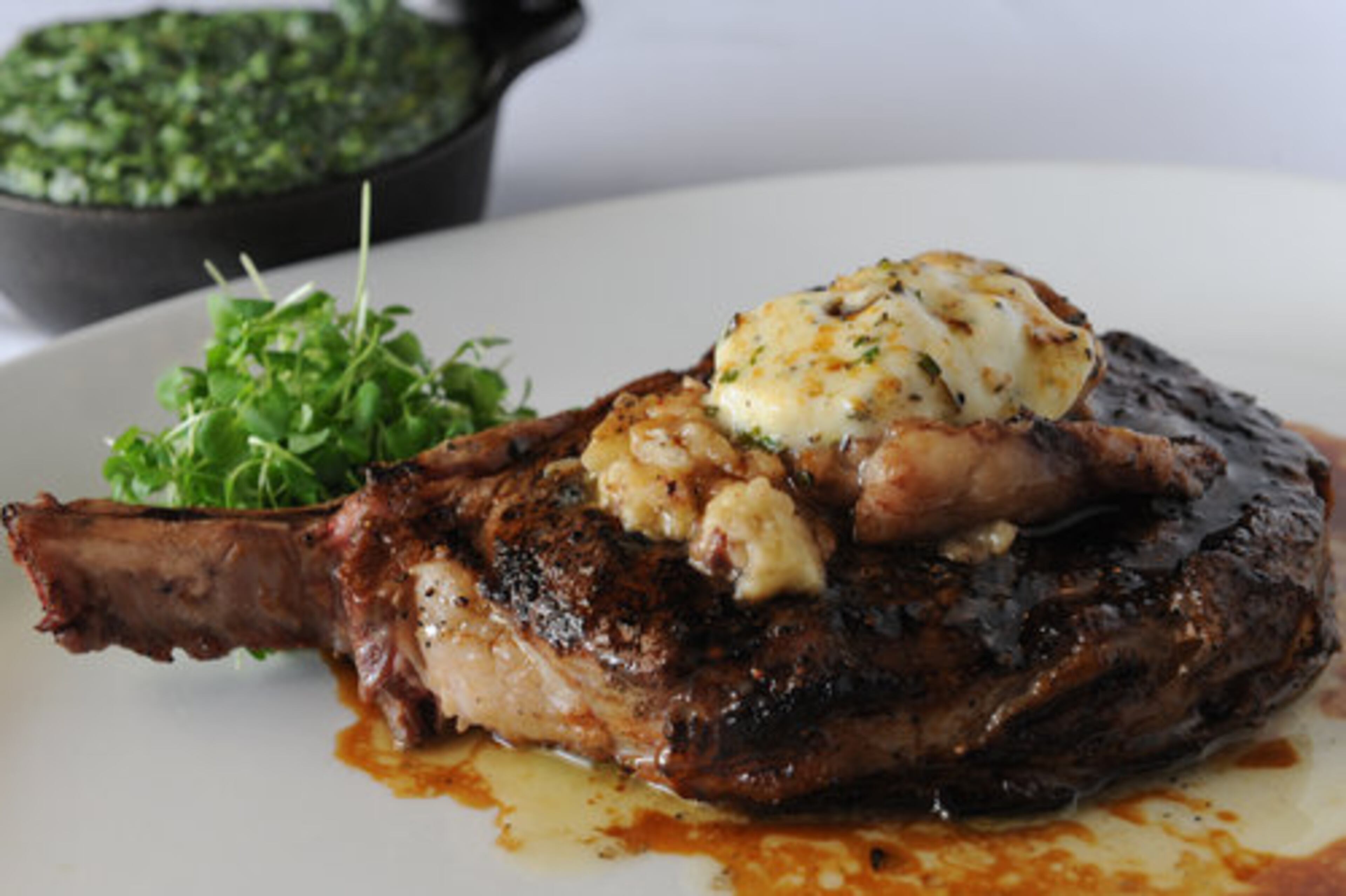 The delmonico ribeye with chapeau of marrow and shallot butter and classic creamed spinach at Viande Rouge Steakhouse in Johns Creek. "The Franco-American fantasy world of Viande Rouge always leaves me with a smile," John Kessler writes. Three stars.