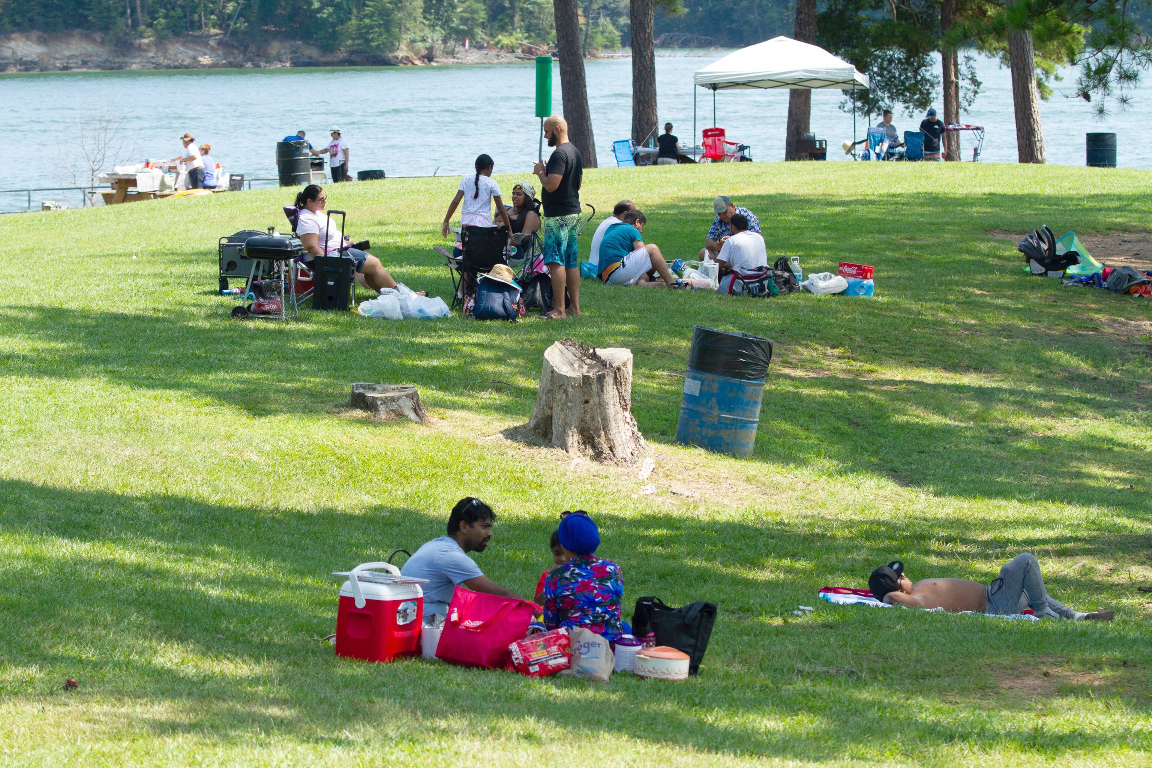 People enjoy a Sunday picnic at Mary Alice Park on Lake Lanier, September 6, 2020. STEVE SCHAEFER / SPECIAL TO THE AJC