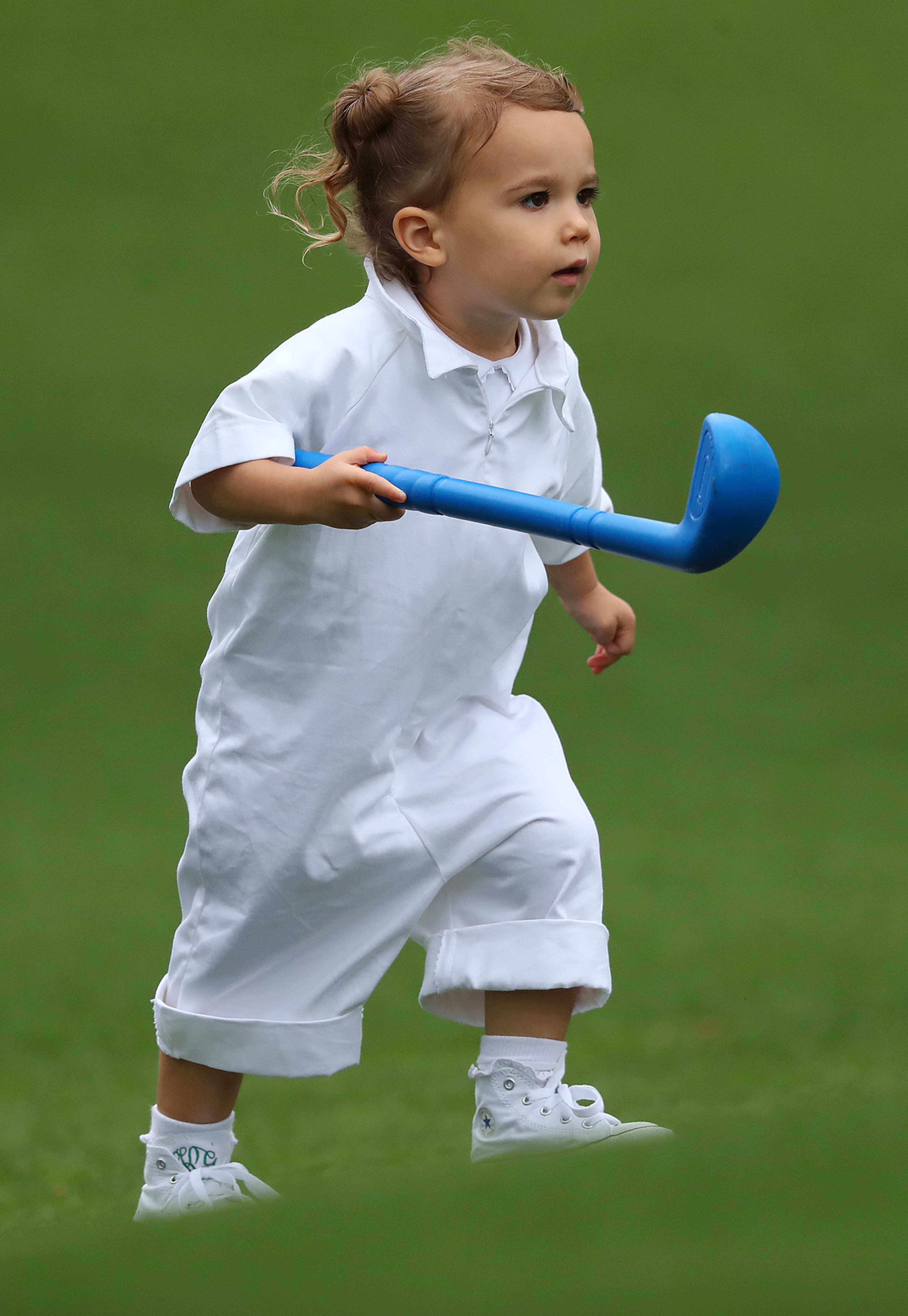 April 5, 2017, Augusta: Kevin Kisnerâs daughter Kate has her own club on the first fairway while playing the Par 3 contest with her dad at Augusta National Golf Club on Wednesday, April 5, 2017, in Augusta. Curtis Compton/ccompton@ajc.com