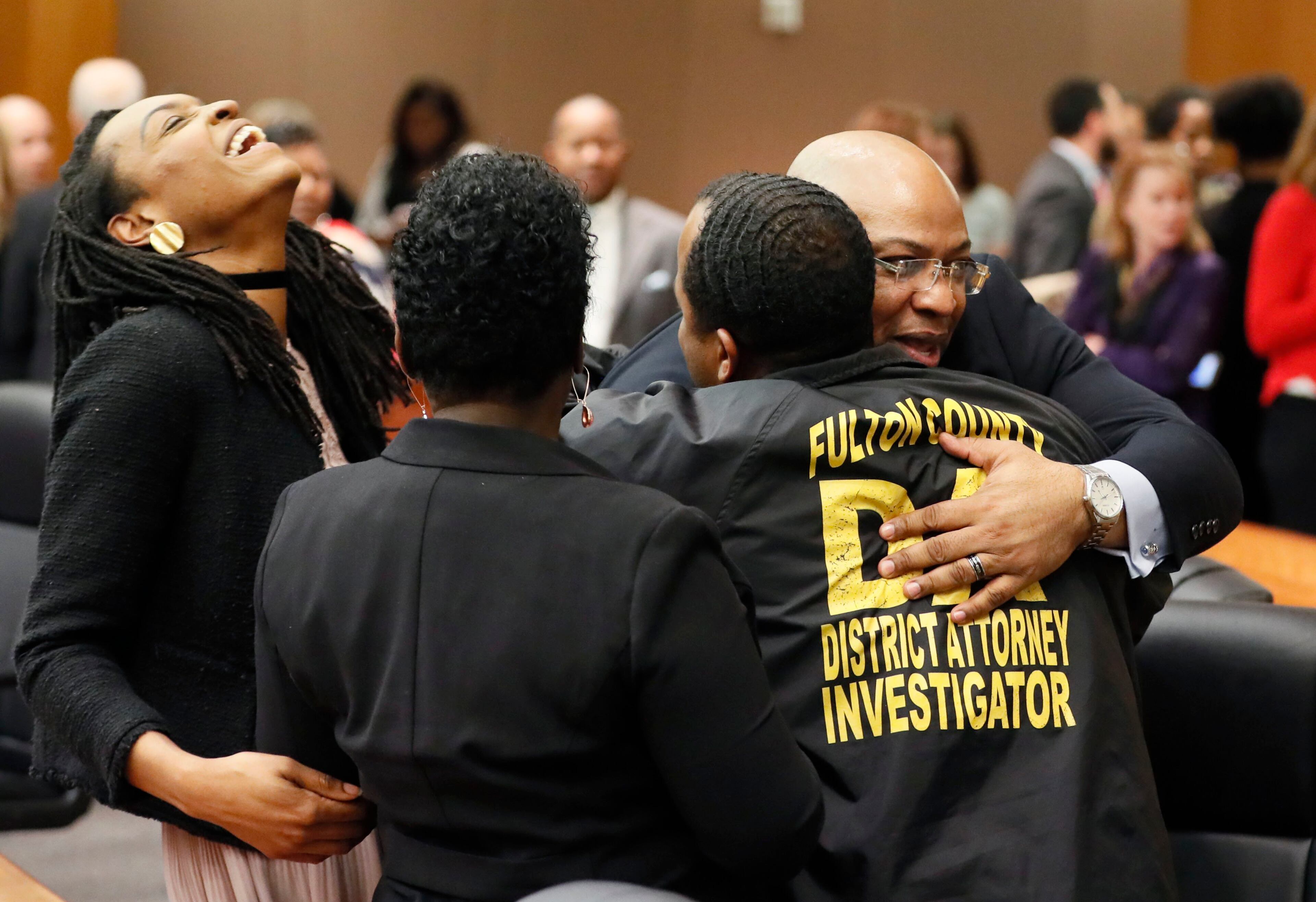 4/23/18 - Atlanta - Chief Assistant District Attorney Clint Rucker (right) is congratulated after the verdict. The jury found Tex McIver guilty on four of five charges on their fifth day of deliberations today at the Tex McIver murder trial at the Fulton County Courthouse. Bob Andres bandres@ajc.com