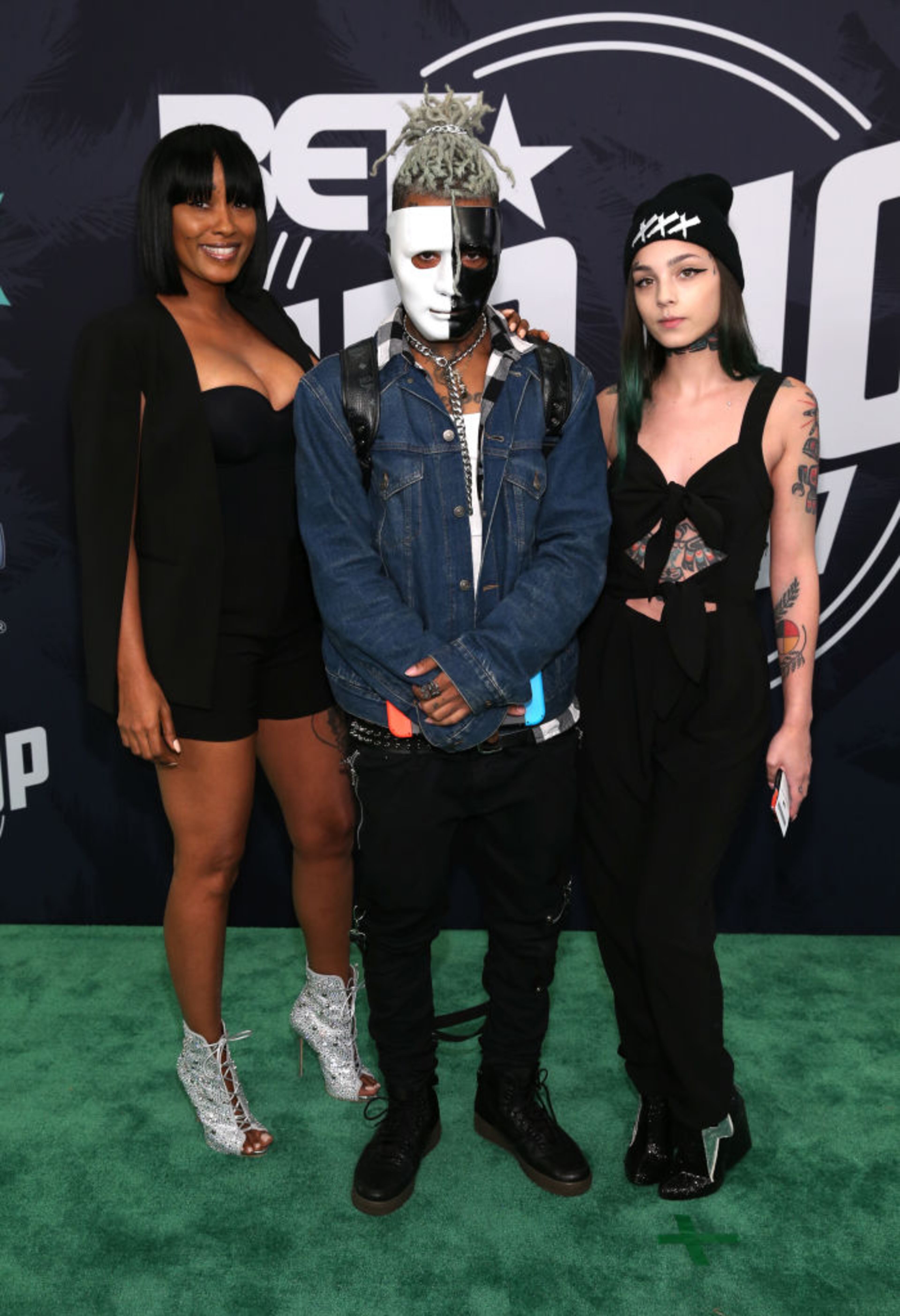 MIAMI BEACH, FL - OCTOBER 06: Rapper XXXTentacion (C) attends the BET Hip Hop Awards 2017 at The Fillmore Miami Beach at the Jackie Gleason Theater on October 6, 2017 in Miami Beach, Florida. (Photo by Bennett Raglin/Getty Images for BET )