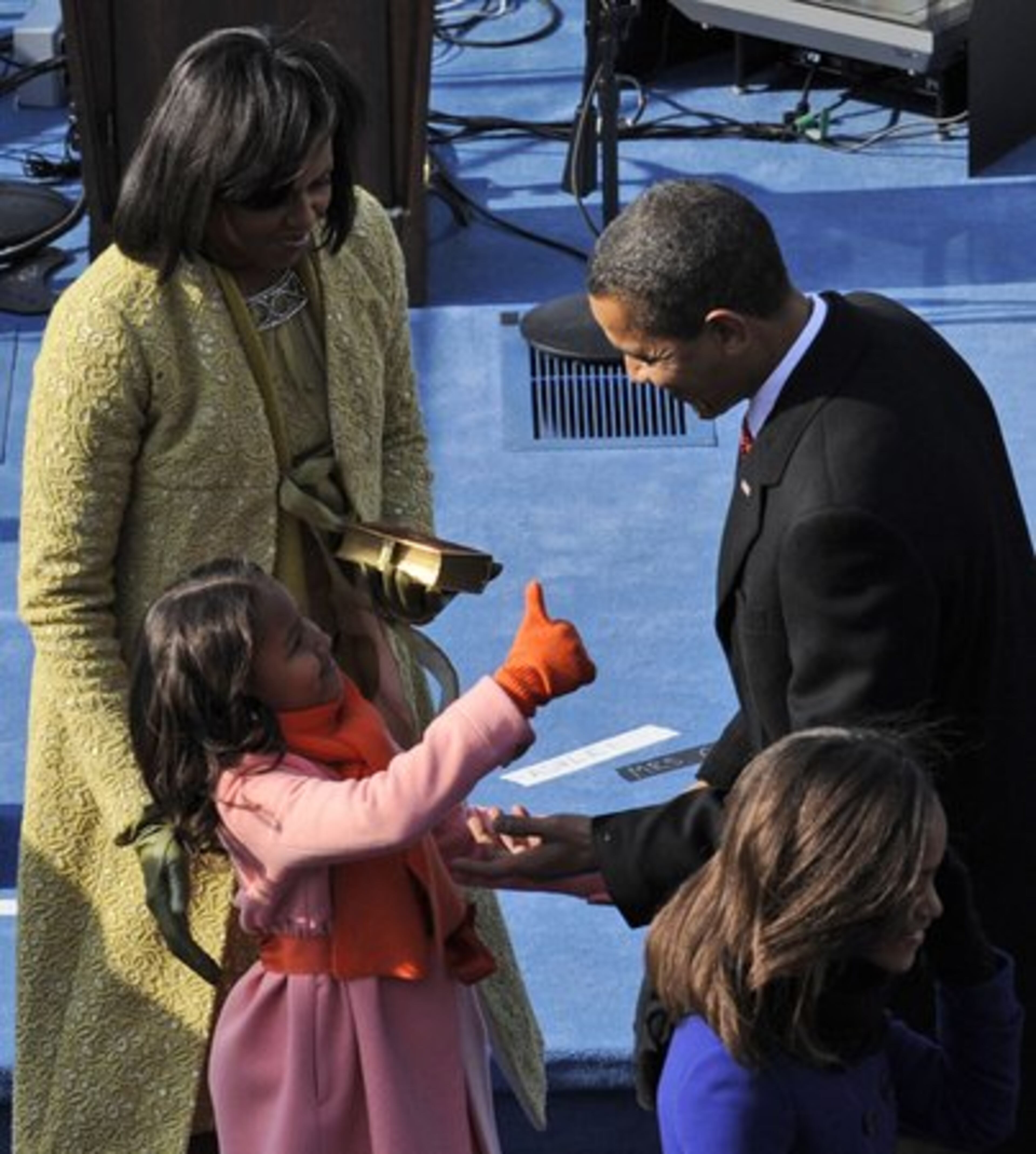 President Obama gets a thumbs-up from daughter Sasha after being sworn in.