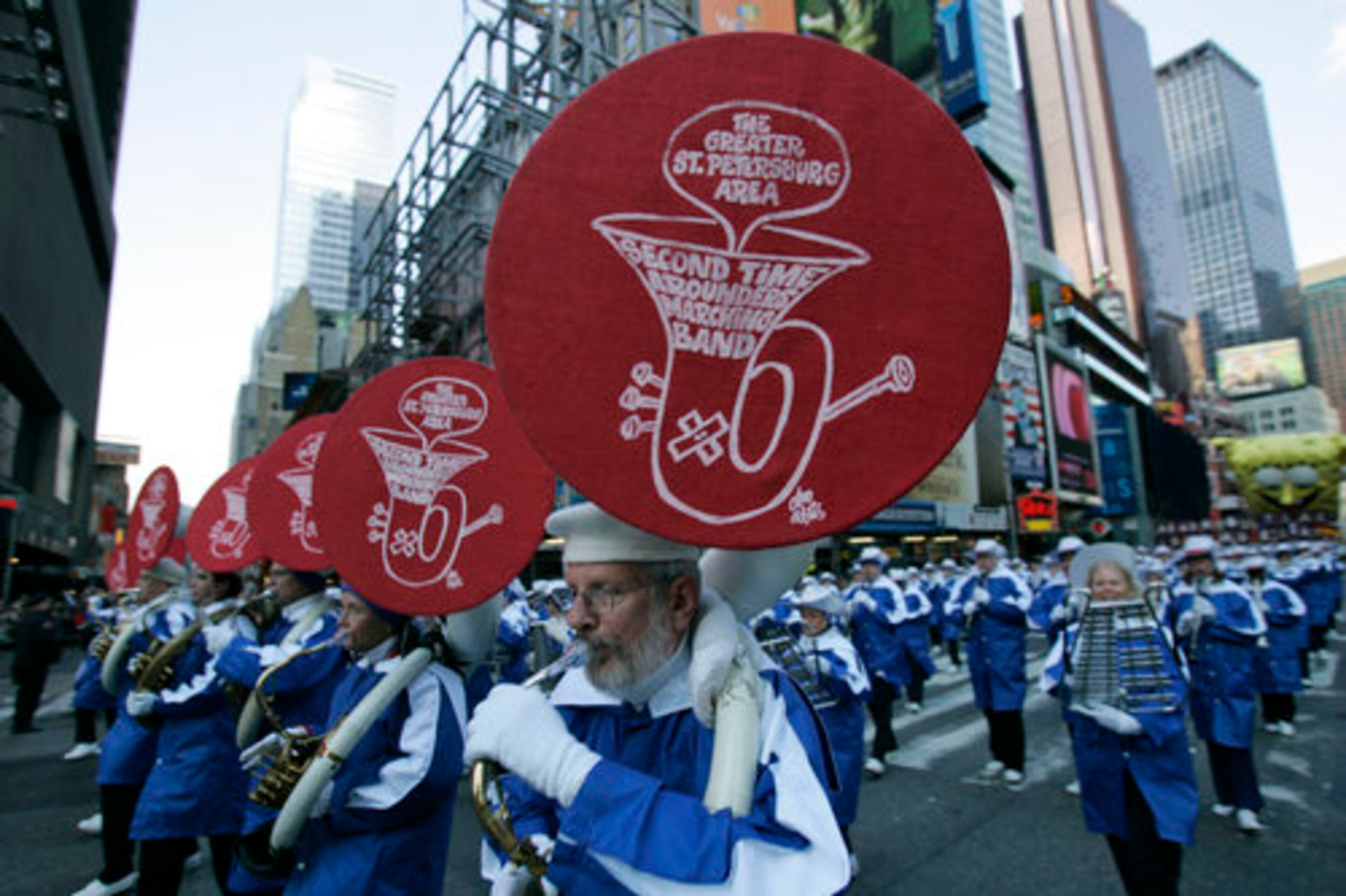The Second Time Arounders Marching band, of St. Petersburg, Fla. move down Broadway.