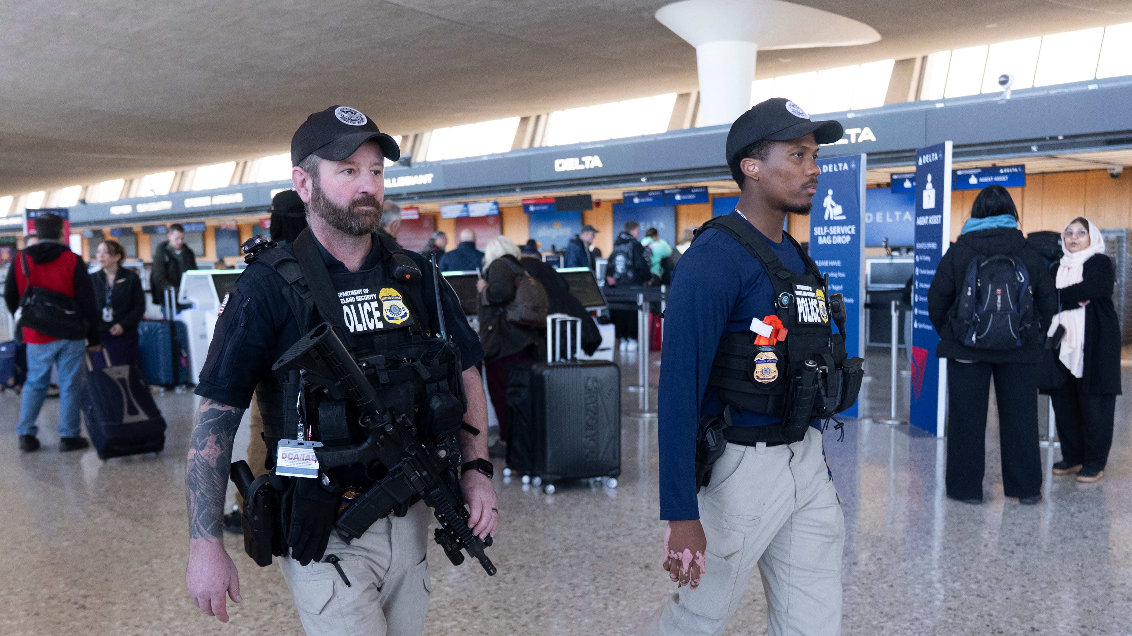 FILE - Department of Homeland Security, Transportation Security Administration, Federal Air Marshals, patrol around Washington Dulles International Airport, in Chantilly, Va., Tuesday, March 24, 2026. (AP Photo/Manuel Balce,File)