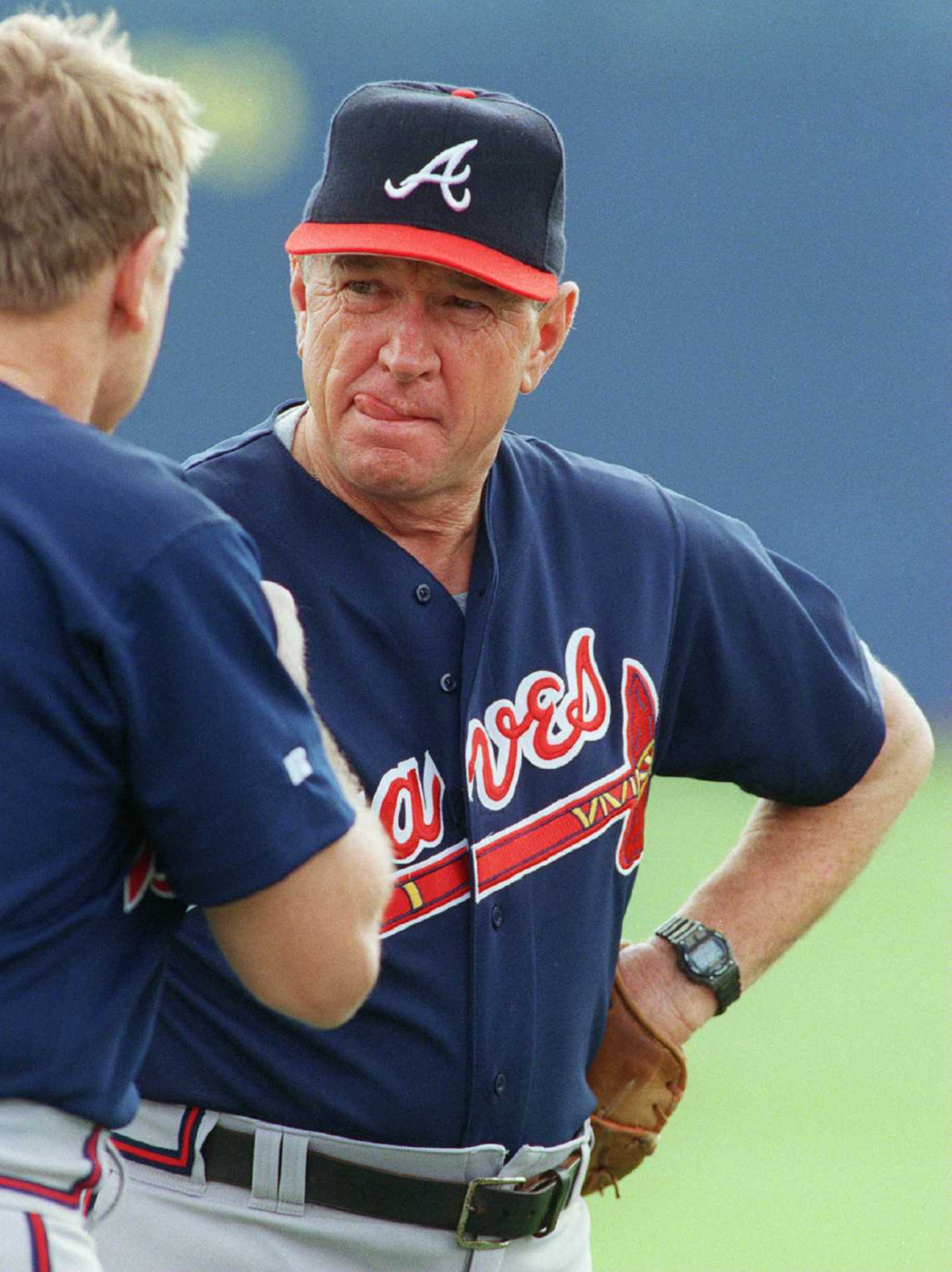 970219 - West Palm Beach, Florida - Atlanta Braves coach Bobby Dews talks with strength and conditioning coach Frank Fultz during spring training at West Palm Municipal Stadium on Wednesday, February 19, 1997. (AJC Staff Photo/Phil Skinner)