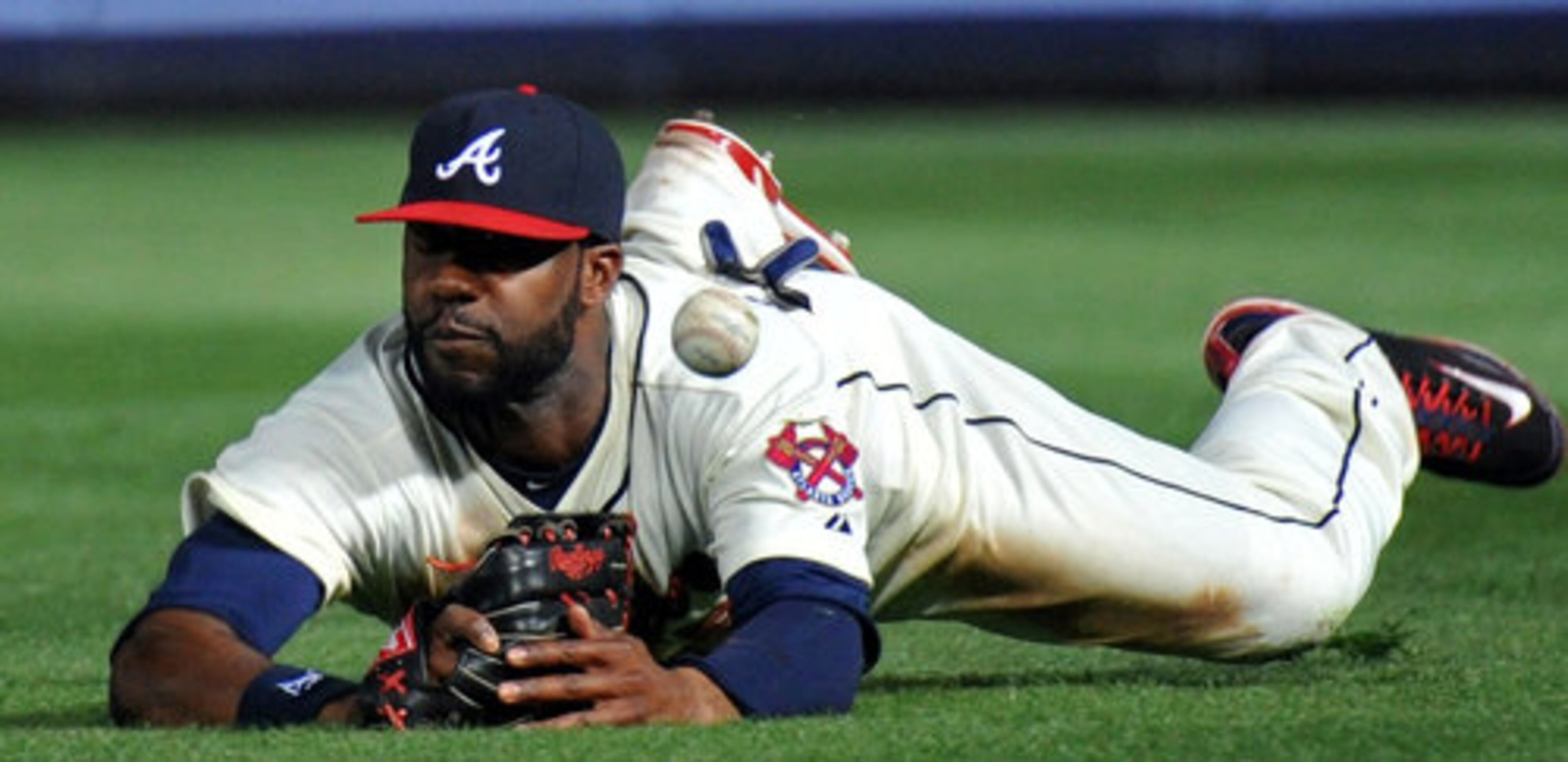 Atlanta Braves right fielder Jason Heyward (22) is not able to catch a single by Milwaukee Brewers third baseman Mat Gamel (24) in the 8th inning at Turner Field in Atlanta on Saturday, April 14, 2012. Atlanta Braves won 2-1 over the Milwaukee Brewers.