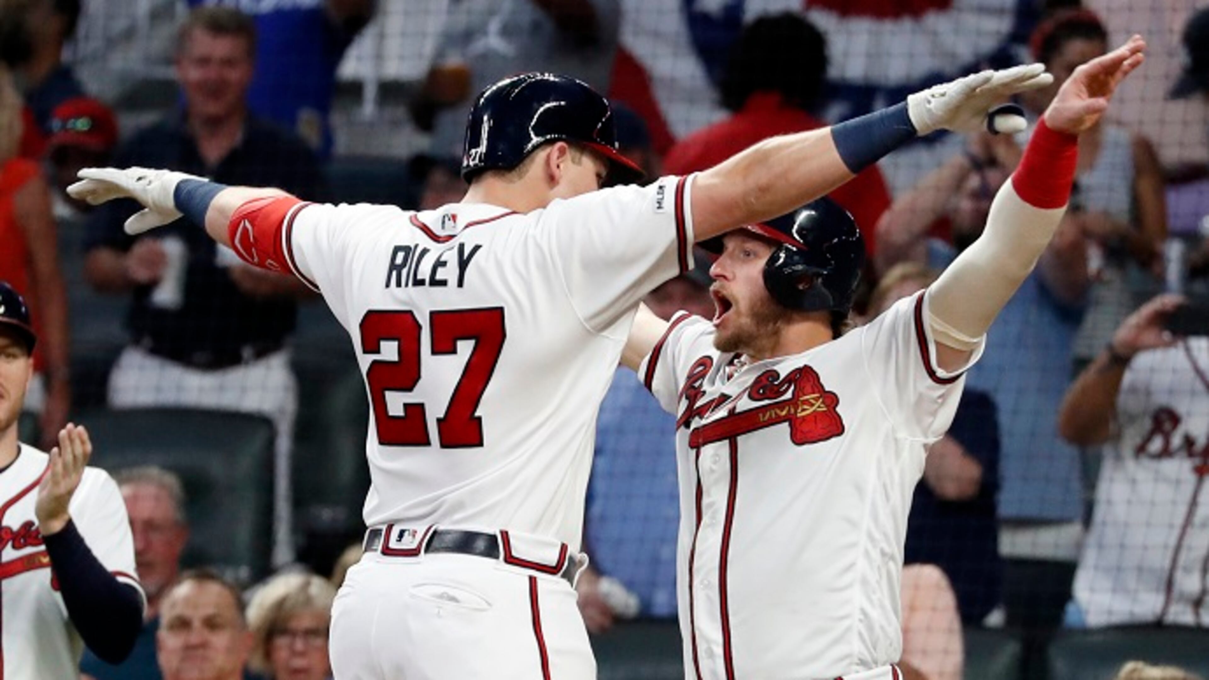Atlanta Braves' Austin Riley (27) celebrates with Josh Donaldson after hitting a three-run home run in the sixth inning of a baseball game against the Philadelphia Phillies Wednesday, July 3, 2019, in Atlanta. (AP Photo/John Bazemore)