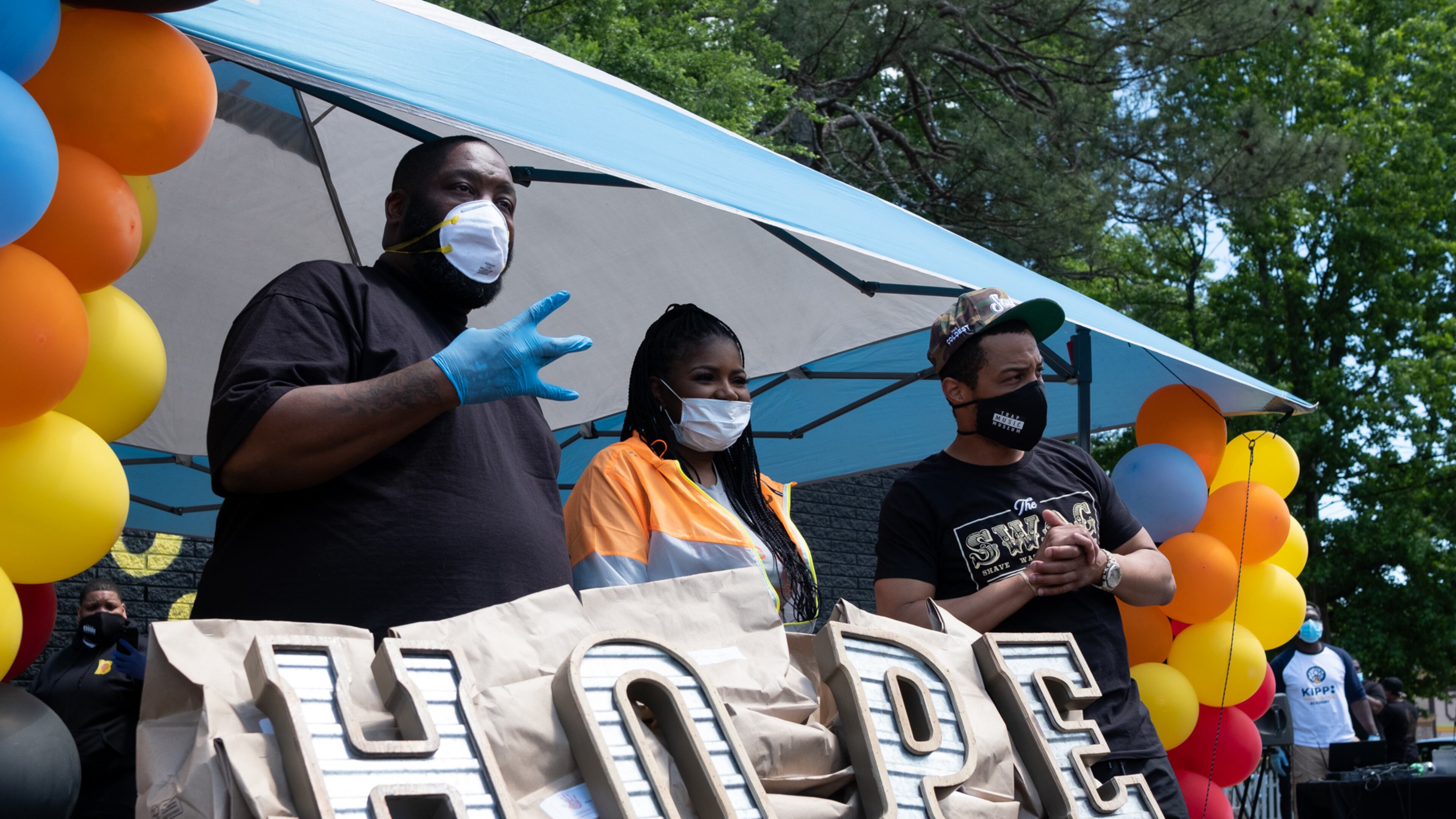 200506-Atlanta-Killer Mike, T.I. and PAWkids founder and Executive Director LaTonya Gates pose for photos during a food distribution event Wednesday afternoon May 6, 2020 on Donald Lee Hollowell Parkway. Every Wednesday and Friday, PAWkids distributes 500 meals donated by Mercedes-Benz. Ben@BenGray.com for the Atlanta Journal Constitution