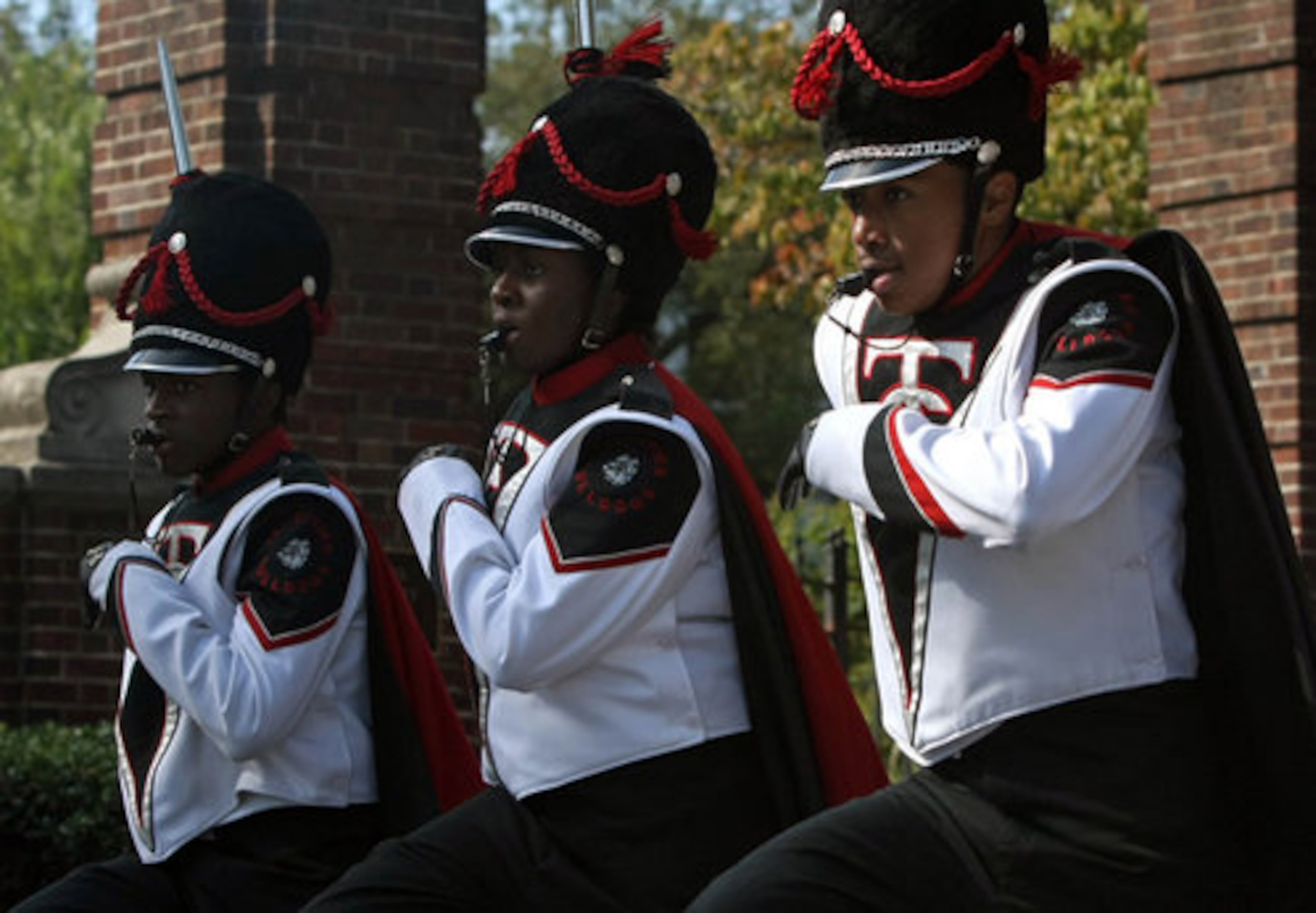 Drum majors lead the Tri-Cities High School Marching Bulldogs Band.