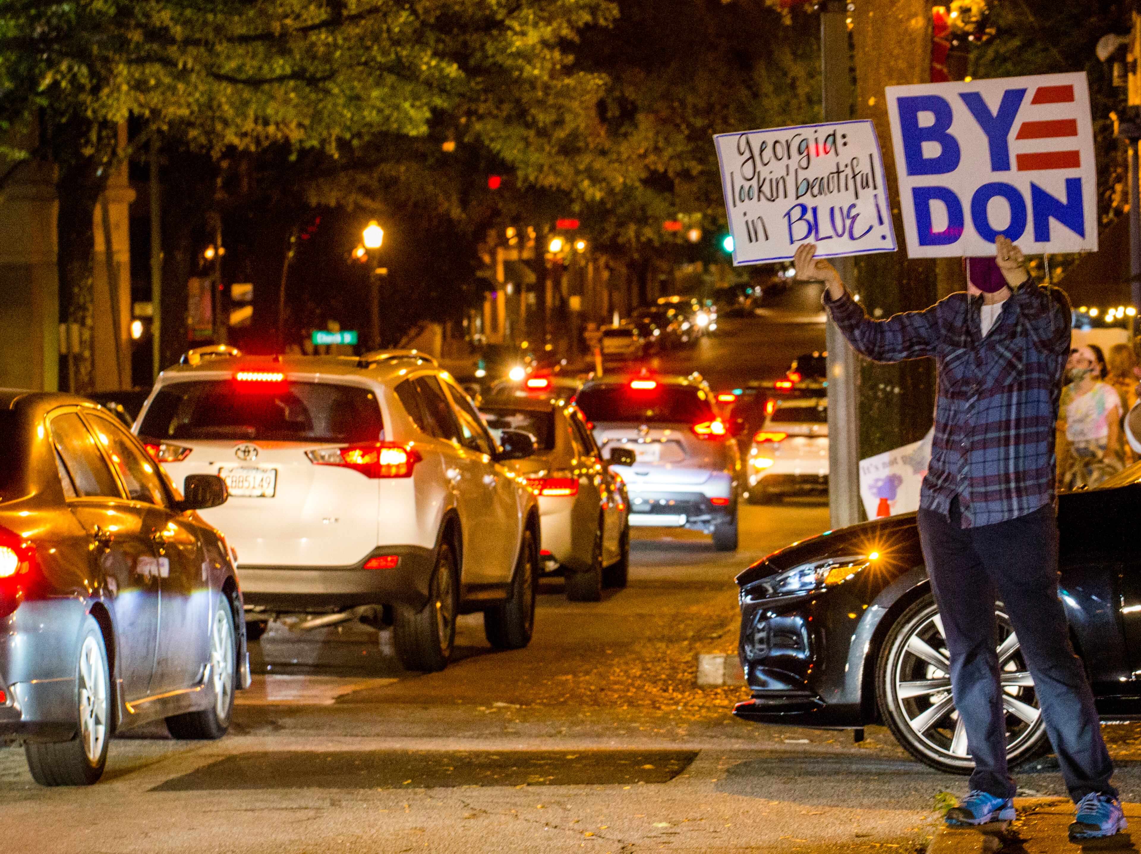 Biden supporters take to the streets in Decatur along W Ponce de Leon Ave as elections results become more clear and celebrations of President-Elect Joe Biden and VP Kamala Harris take place all over Atlanta on Saturday, Nov 7, 2020. (Jenni Girtman for The Atlanta Journal-Constitution)