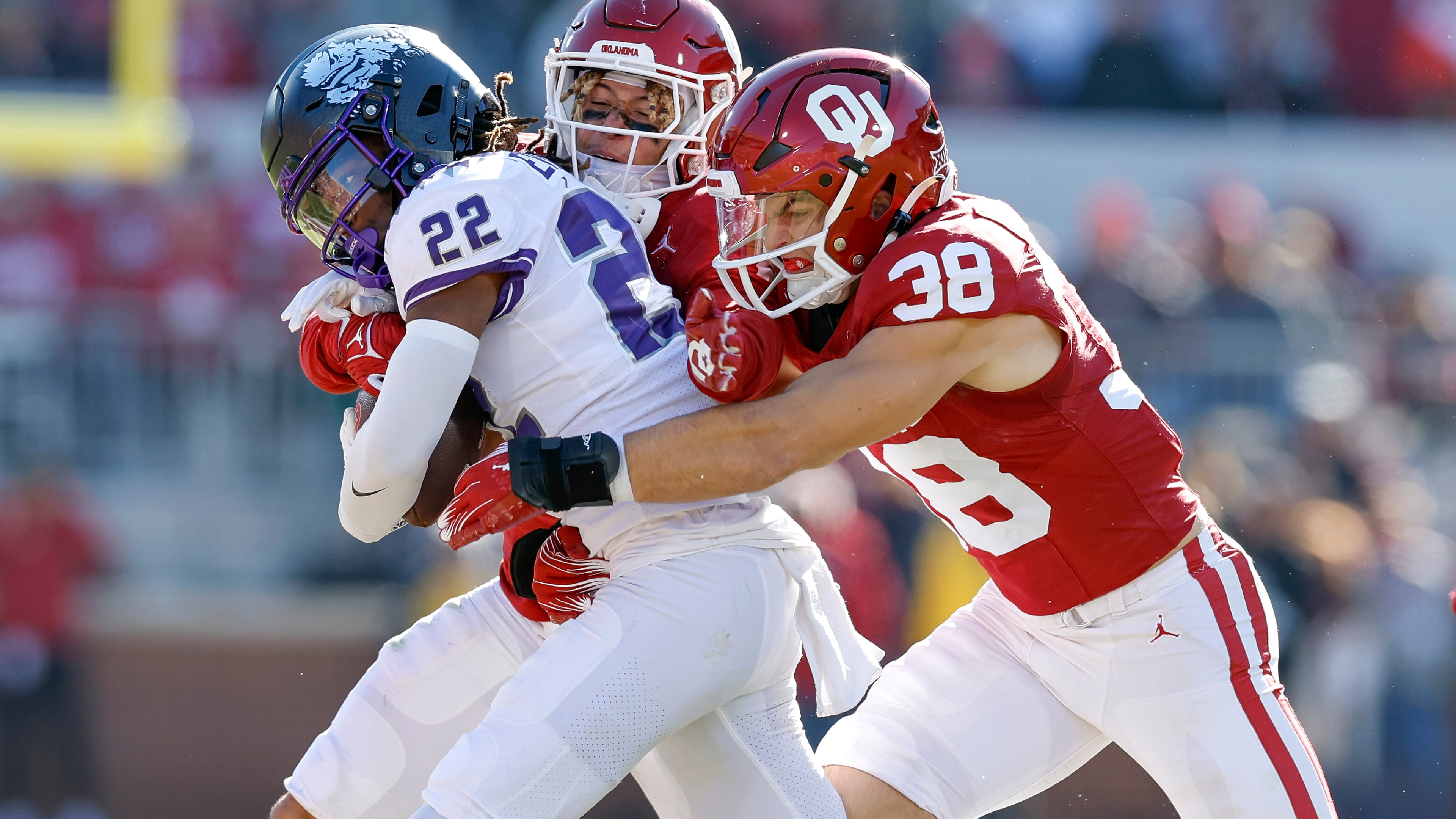 FILE - Oklahoma linebacker Owen Heinecke (38) tackles TCU wide receiver Major Everhart (22) during the second half of an NCAA college football game, Nov. 24, 2023, in Norman, Okla. (AP Photo/Alonzo Adams, File)