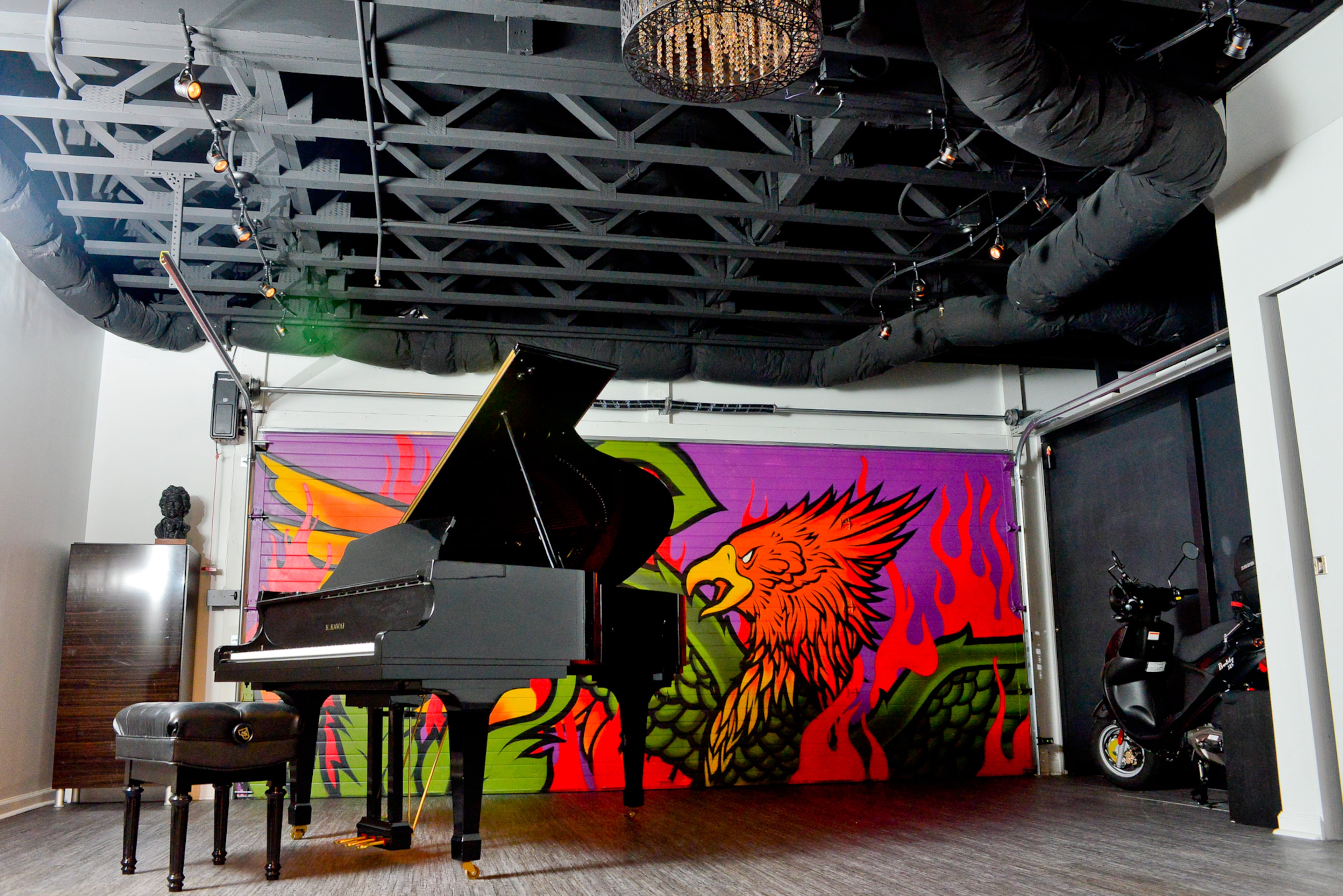 The music studio is homeowner and pianist Catherine Giel's favorite room, now that it has been transformed from a first-floor garage and tiny office space. "It has a great energy, and we spend a lot of our time there each week in rehearsals, lessons and practice sessions," she said. The room is also where the homeowners keep their scooter, which they use instead of a car to around town. Text by Lori Johnston and Kelsey E. Green/Fast Copy News Service.