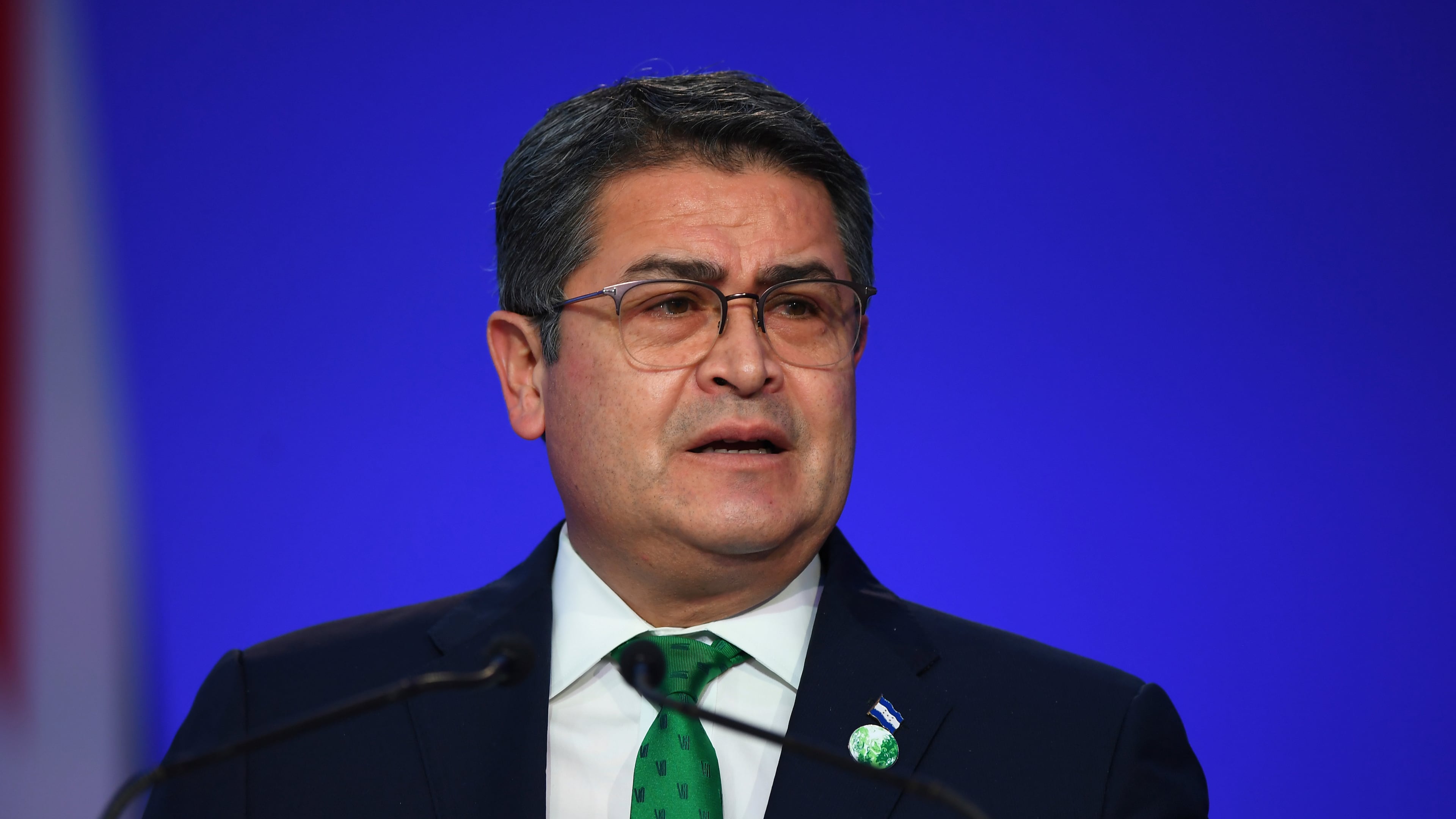 FILE - Honduras' President Juan Orlando Hernandez speaks during the opening ceremony of the UN Climate Change Conference COP26 in Glasgow, Scotland, Monday Nov. 1, 2021. (Andy Buchanan/Pool via AP, File)