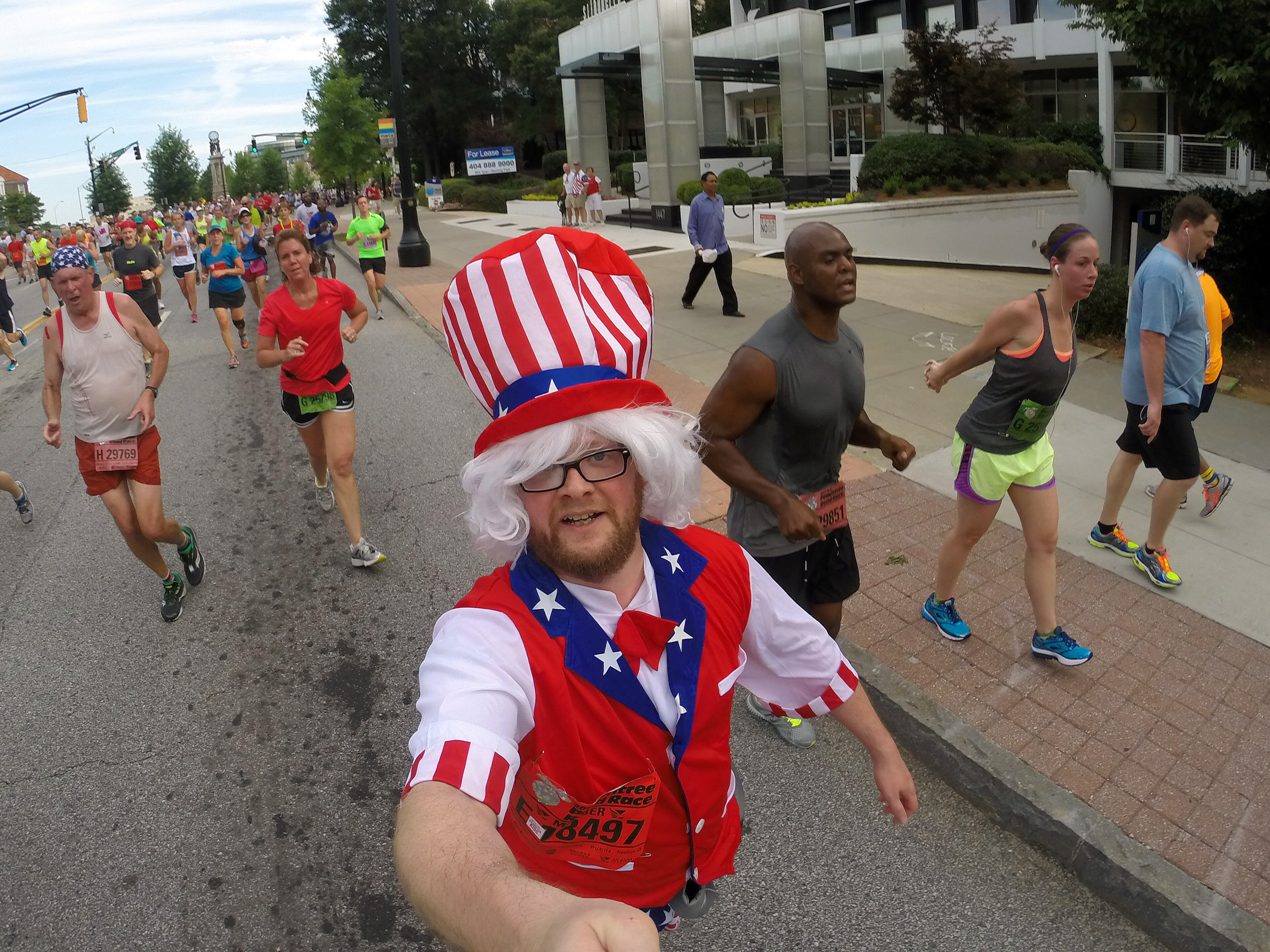 For most people, the AJC Peachtree Road Race is all about getting out and having fun with 60,000 other revelers. With that in mind, AJC Photojournalist Ben Gray passed a camera to runners as he made his way South on Friday morning July 4, 2014 and shot "selfies" of the runners as they carried the camera. BEN GRAY / BGRAY@AJC.COM