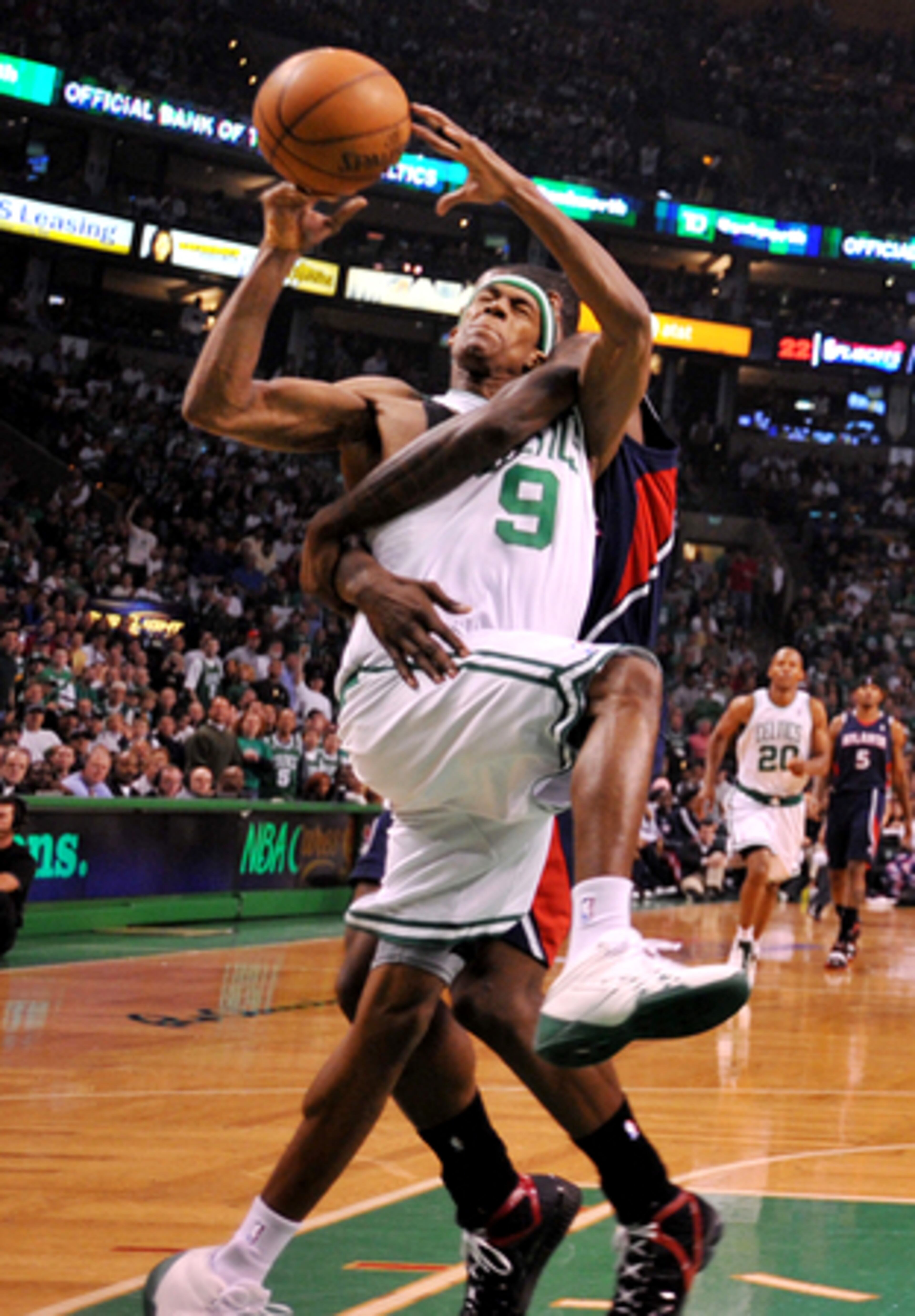 Marvin Williams reaches for Rajon Rondo after chasing him down the floor on a fast break. Williams caught Rondo with his left arm and knocked him to the floor.