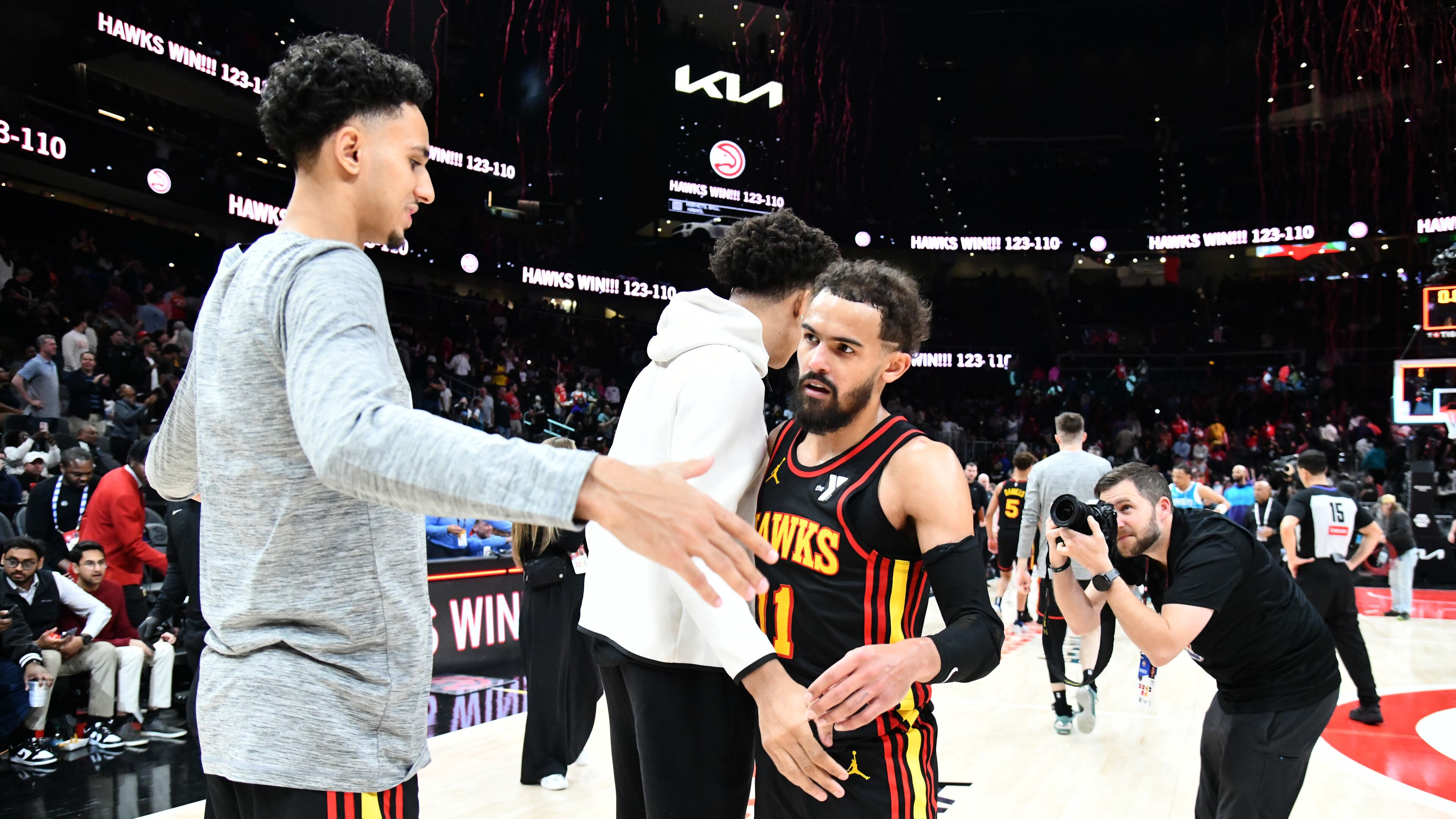 Atlanta Hawks guard Trae Young (11) celebrates with teammates after Atlanta Hawks beat Charlotte Hornets during an NBA basketball game at State Farm Arena, Wednesday, March 12, 2025, in Atlanta. Atlanta Hawks won 123-110 over Charlotte Hornets. (Hyosub Shin / AJC)