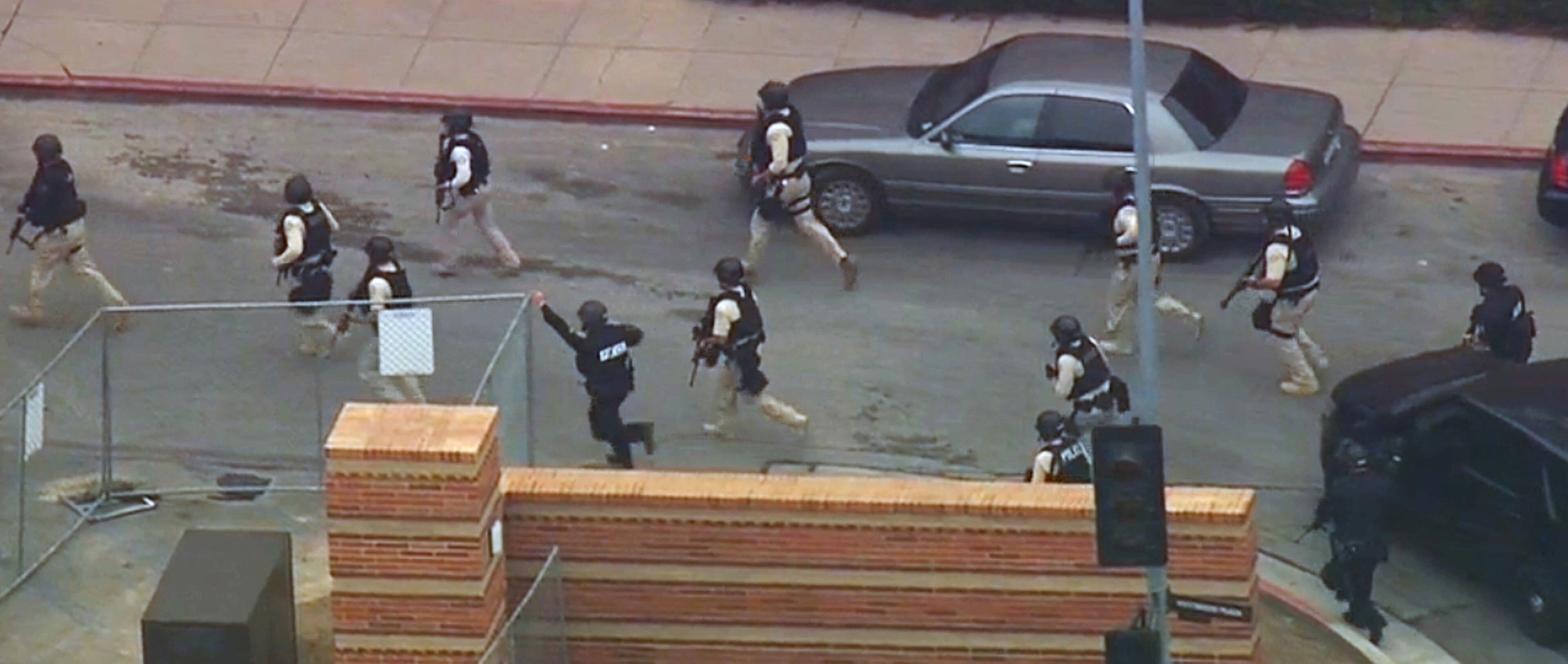 In this image made from video, police respond to a fatal shooting at the University of California, Los Angeles, Wednesday, June 1, 2016, in Los Angeles. (KABC-7 via AP)