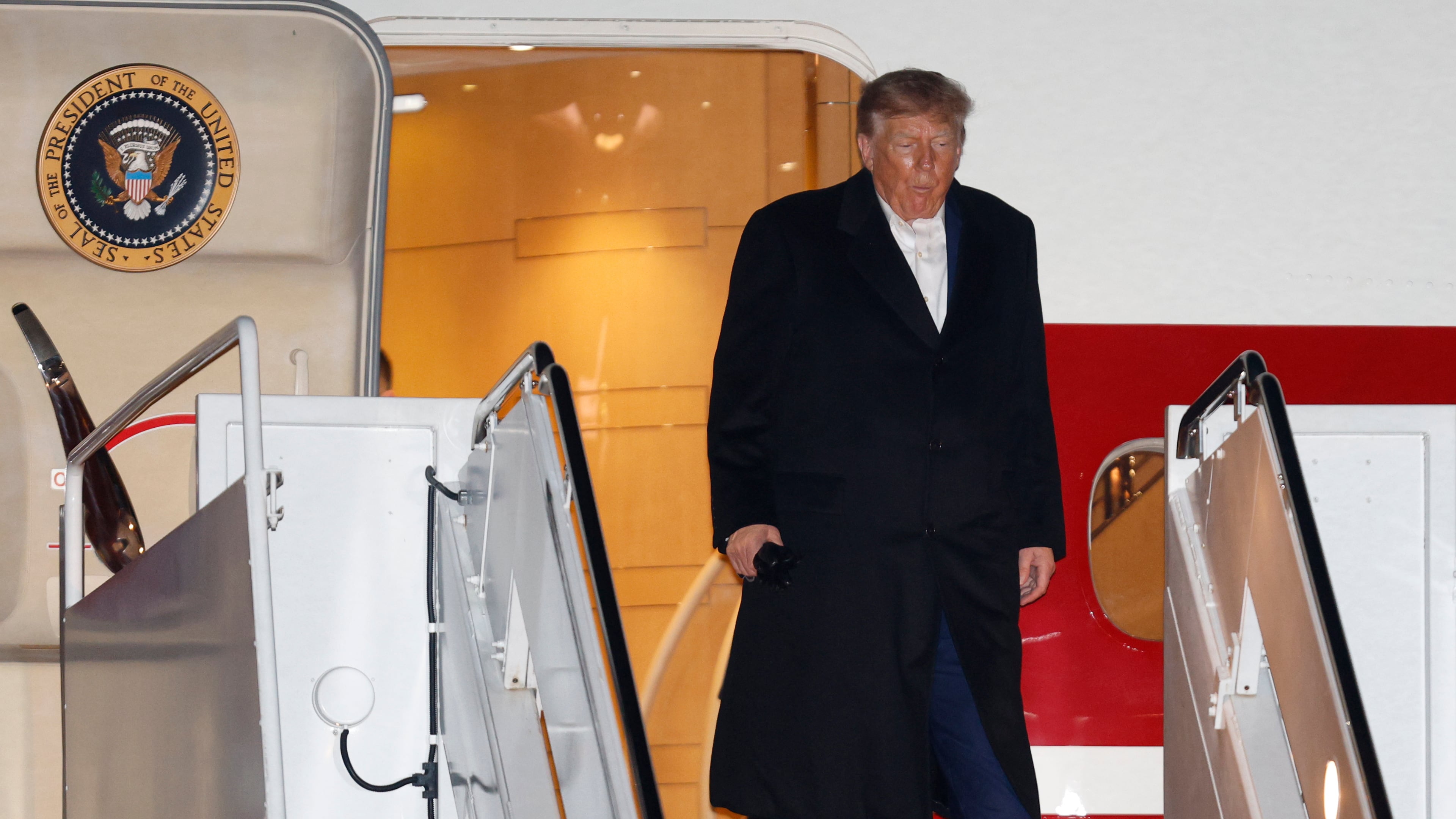 President Donald Trump walks down the stairs of Air Force One upon arriving at Joint Base Andrews, Md., Sunday, Oct. 25, 2026, after a campaign rally in Port Huron, Mich.(AP Photo/Luis M. Alvarez)