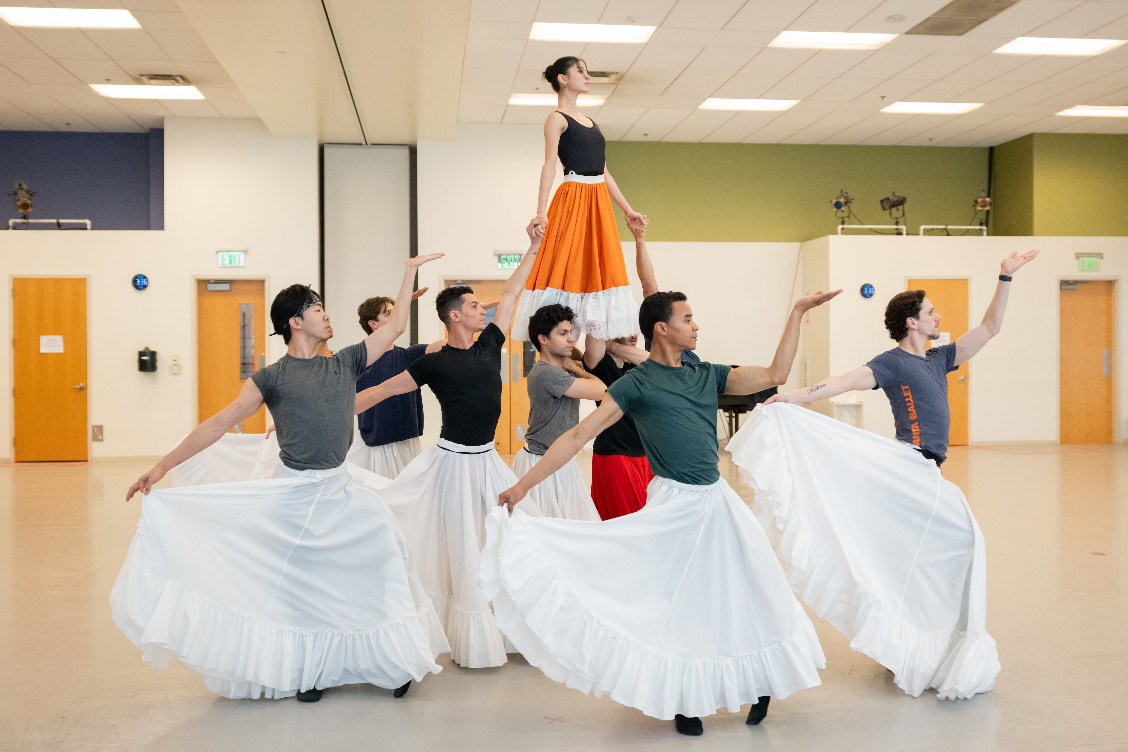 Mikaela Santos, who shares the title role in half of the Atlanta Ballet performances of "Frida" this weekend, is pictured rising above the male chorus. (Courtesy of Shoccara Marcus)