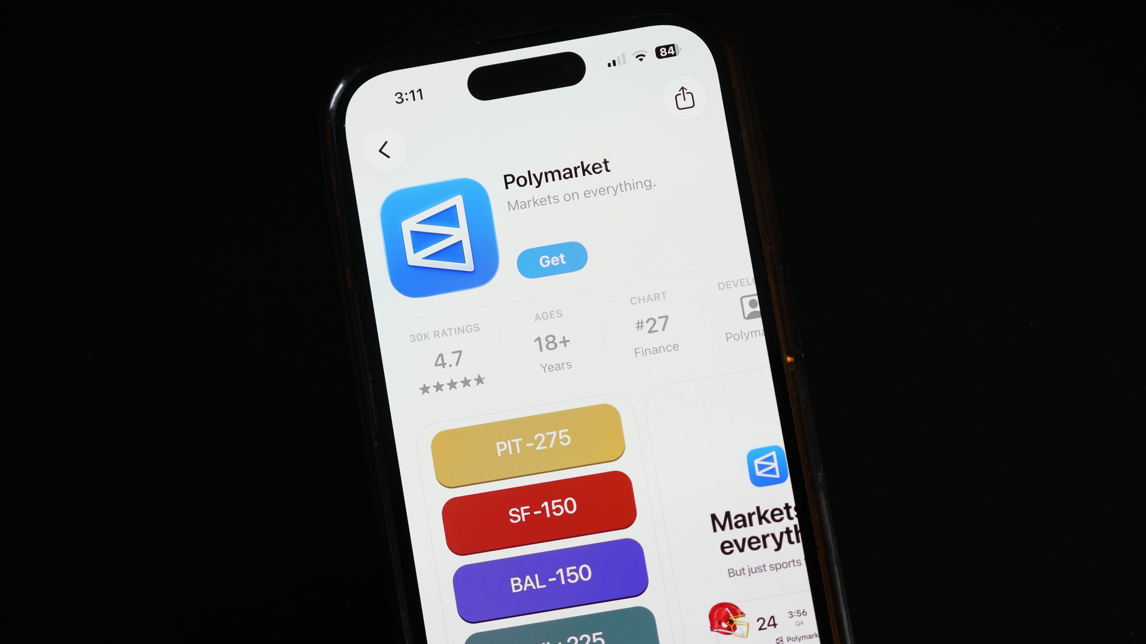 FILE - The prediction market app Polymarket is displayed on a mobile phone, April 16, 2026, in Chicago. (AP Photo/Erin Hooley, File)