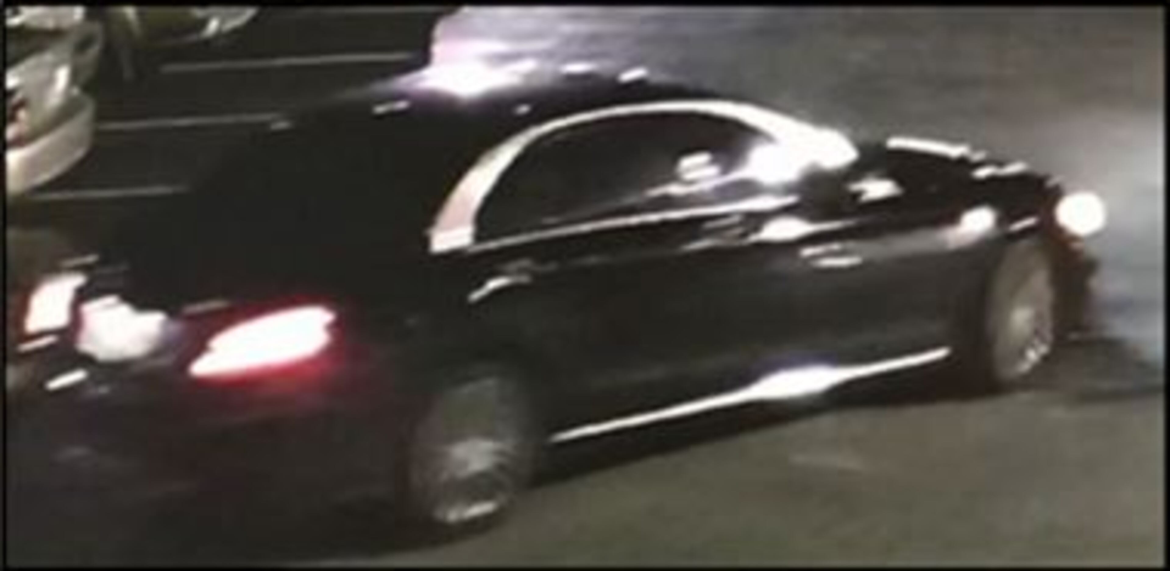 After the shooting, the three suspects fled the scene in a black car.