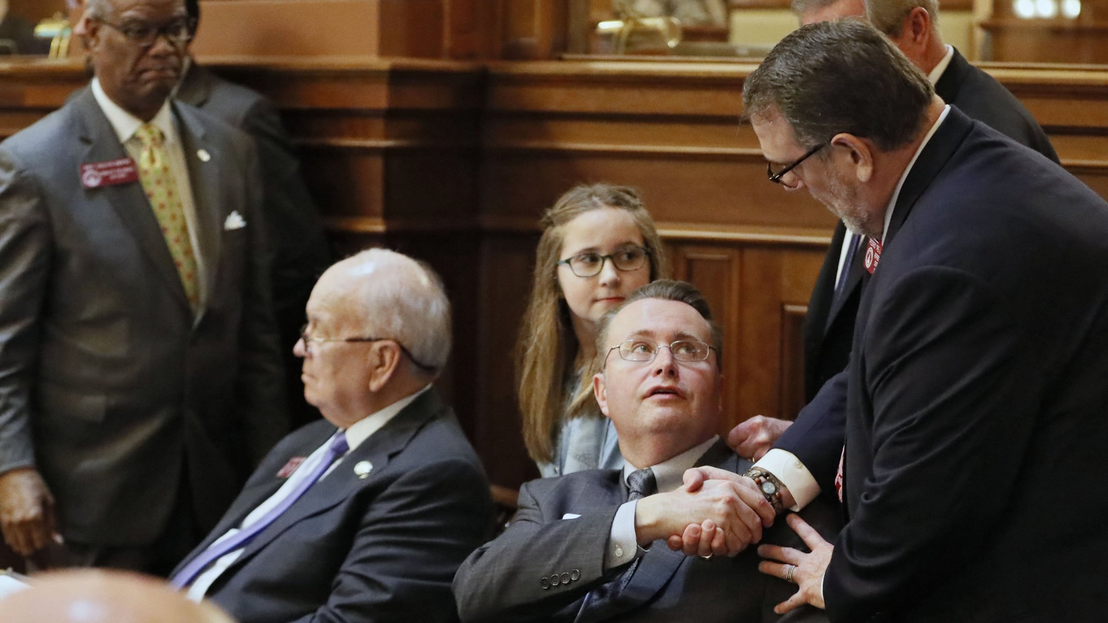 Rep. Kevin Tanner (seated, center), R-Dawsonville, is congratulated after the passage of House Bill 930, one of two bills that could lead to a dramatic expansion of mass transit in metro Atlanta. HB 930 and Senate Bill 386 passed their respective chambers Wednesday. BOB ANDRES /BANDRES@AJC.COM