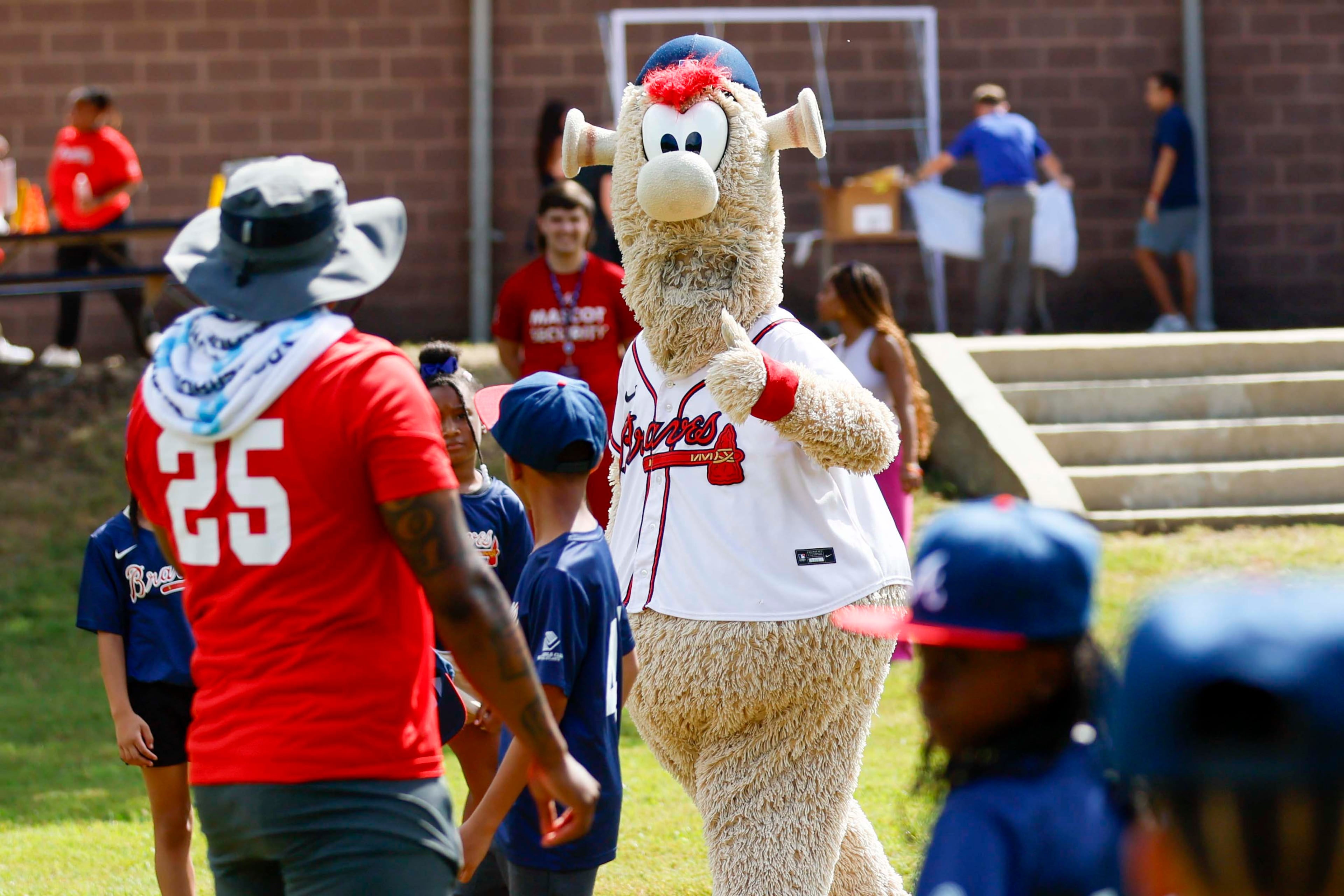 The Atlanta Braves mascot, The Blooper, gives a thumbs-up to a coach during the unveiling of the new All-Star Legacy Field at the Barksdale Boys & Girls Club in Conyers on Thursday, July 10, 2025. The event takes place during the MLB All-Star Game week in Atlanta.
(Miguel Martinez/ AJC)