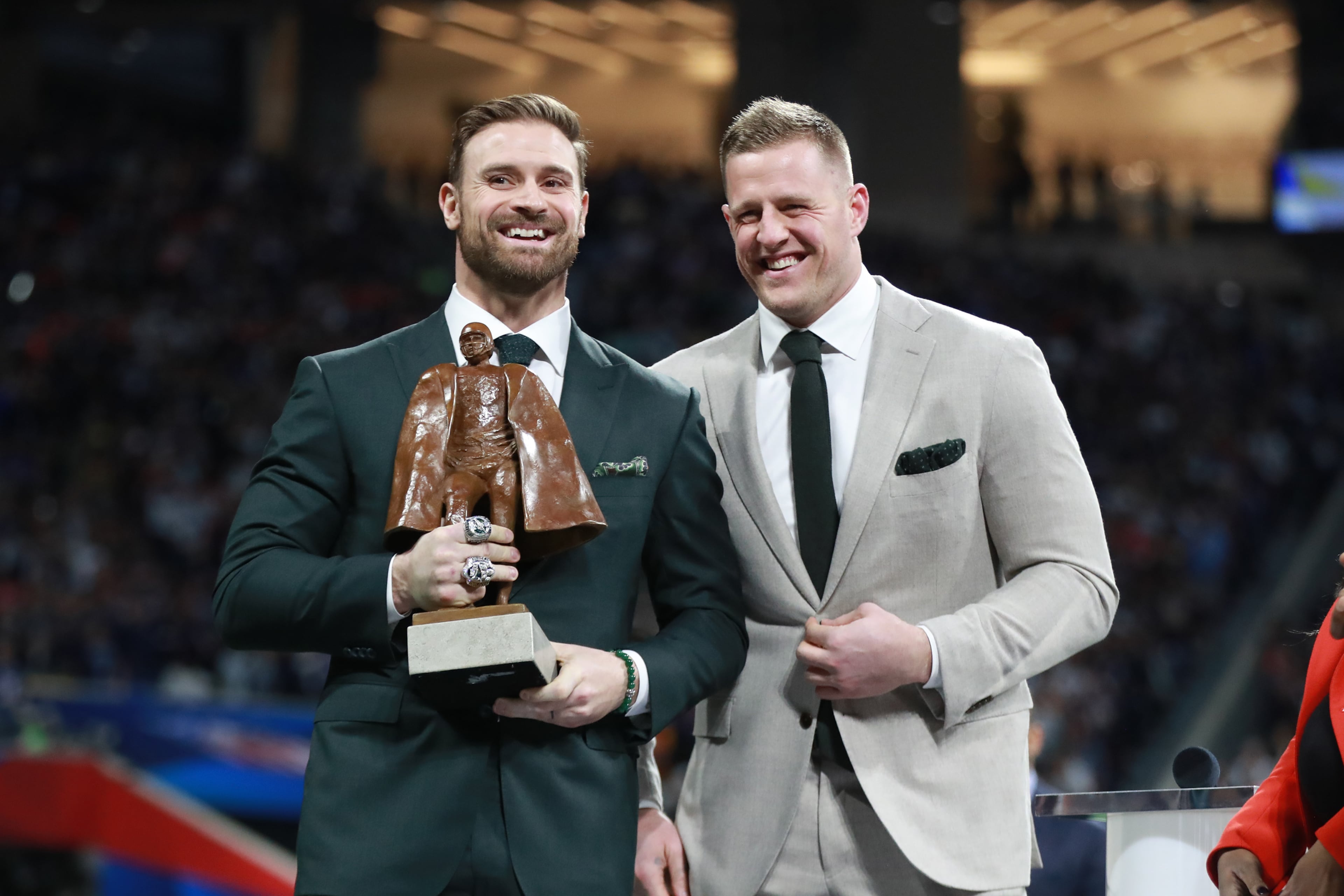 2/3/19 - Atlanta - Chris Long (left) receives the Walter Payton Man of the Year Award before the New England Patriots played the Los Angeles Rams in Super Bowl LIII on Sunday, Feb. 3, 2019 at Mercedes-Benz Stadium in Atlanta, Ga. 
CURTIS COMPTON / CCOMPTON@AJC.COM