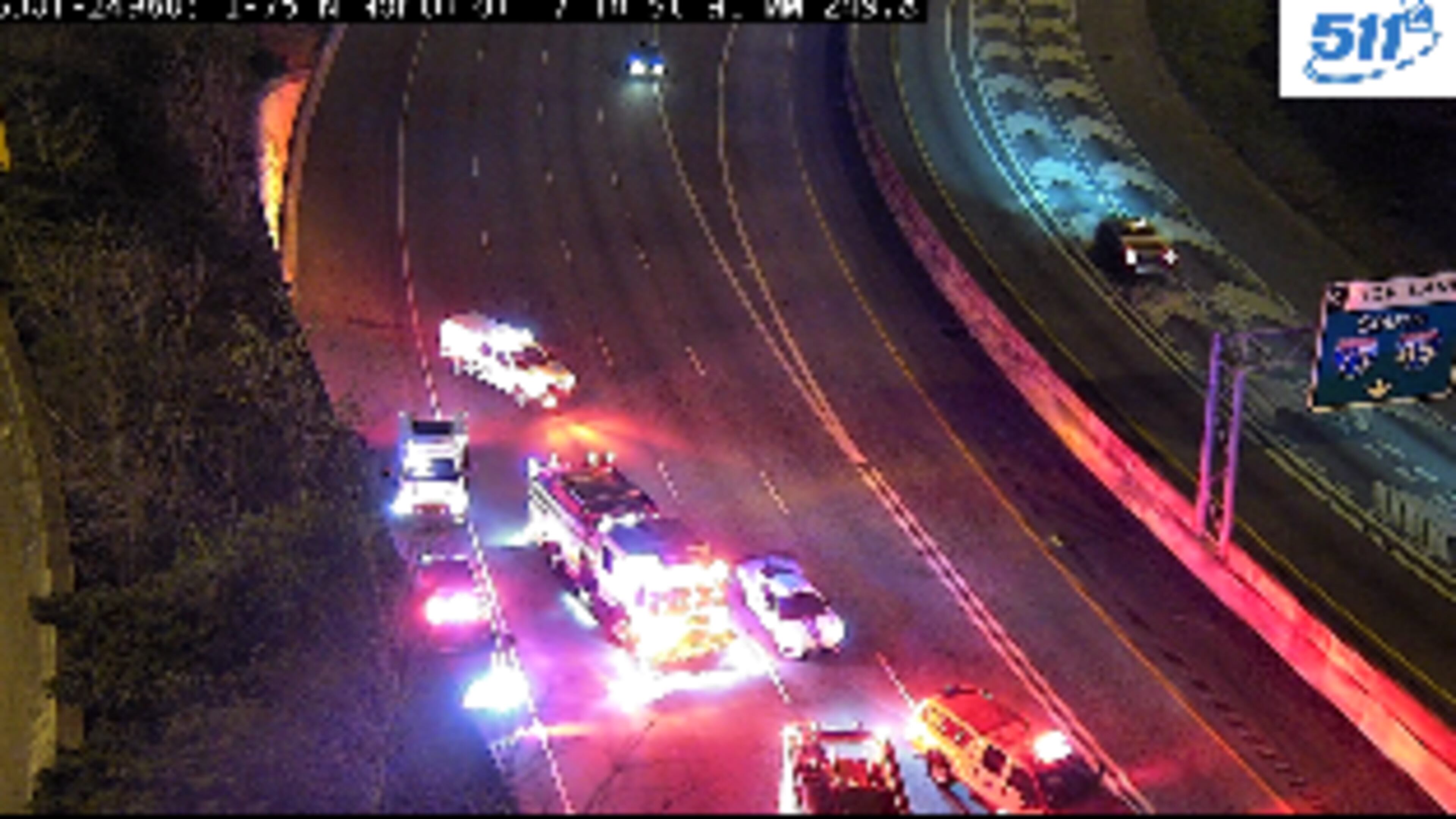 A vehicle flipped over a barrier wall on the Buford Spring Connector and rolled onto I-75 early Saturday morning, according to police.