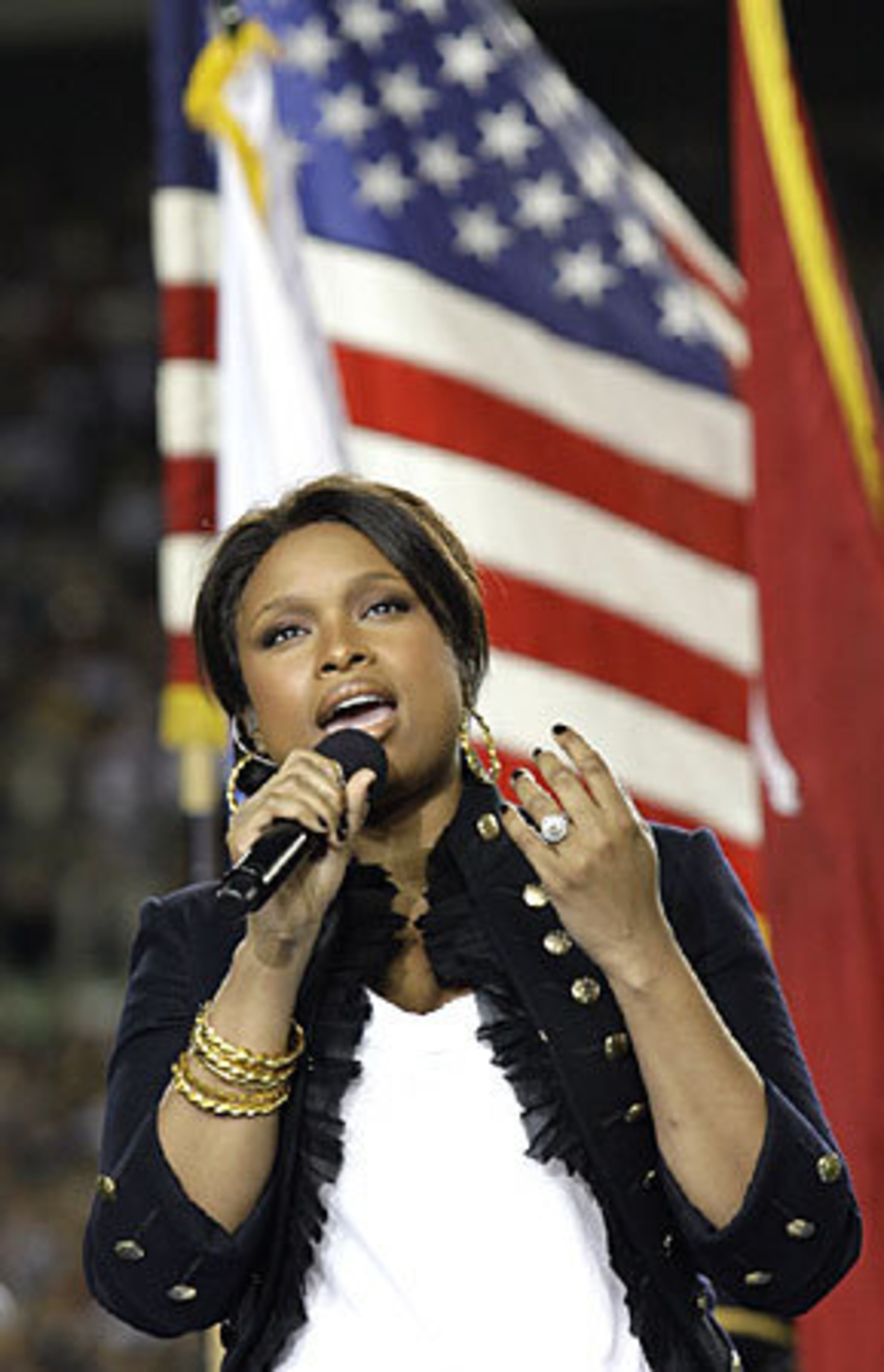 In her first performance since her mother, brother and nephew were slain in Chicago in October, Oscar-winning actress Jennifer Hudson sings the national anthem at Super Bowl XLIII.