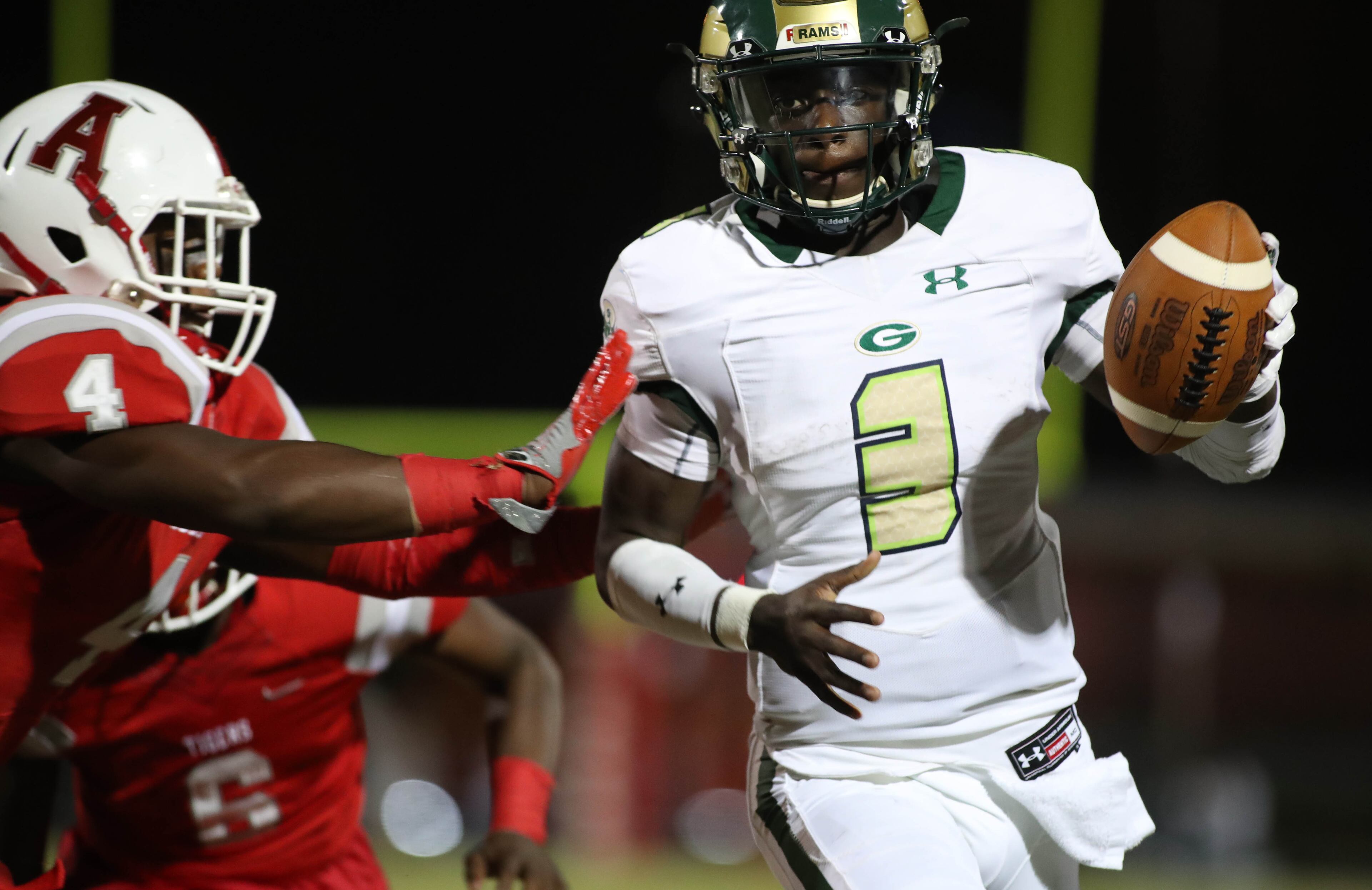 Grayson quarterback DJ Irons (3) is pushed out of bounds by Archer linebacker Emmanuel Michel (4) in the first half at Archer High School Friday, October 13, 2017, in Lawrenceville, Ga.. PHOTO / JASON GETZ